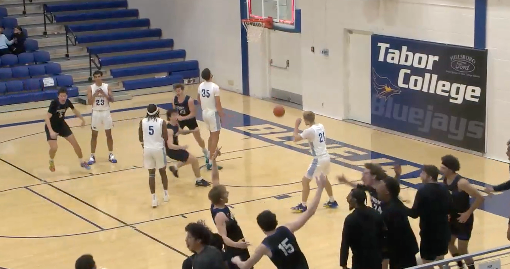 Carroll hits shot at the buzzer and celebrates with the team