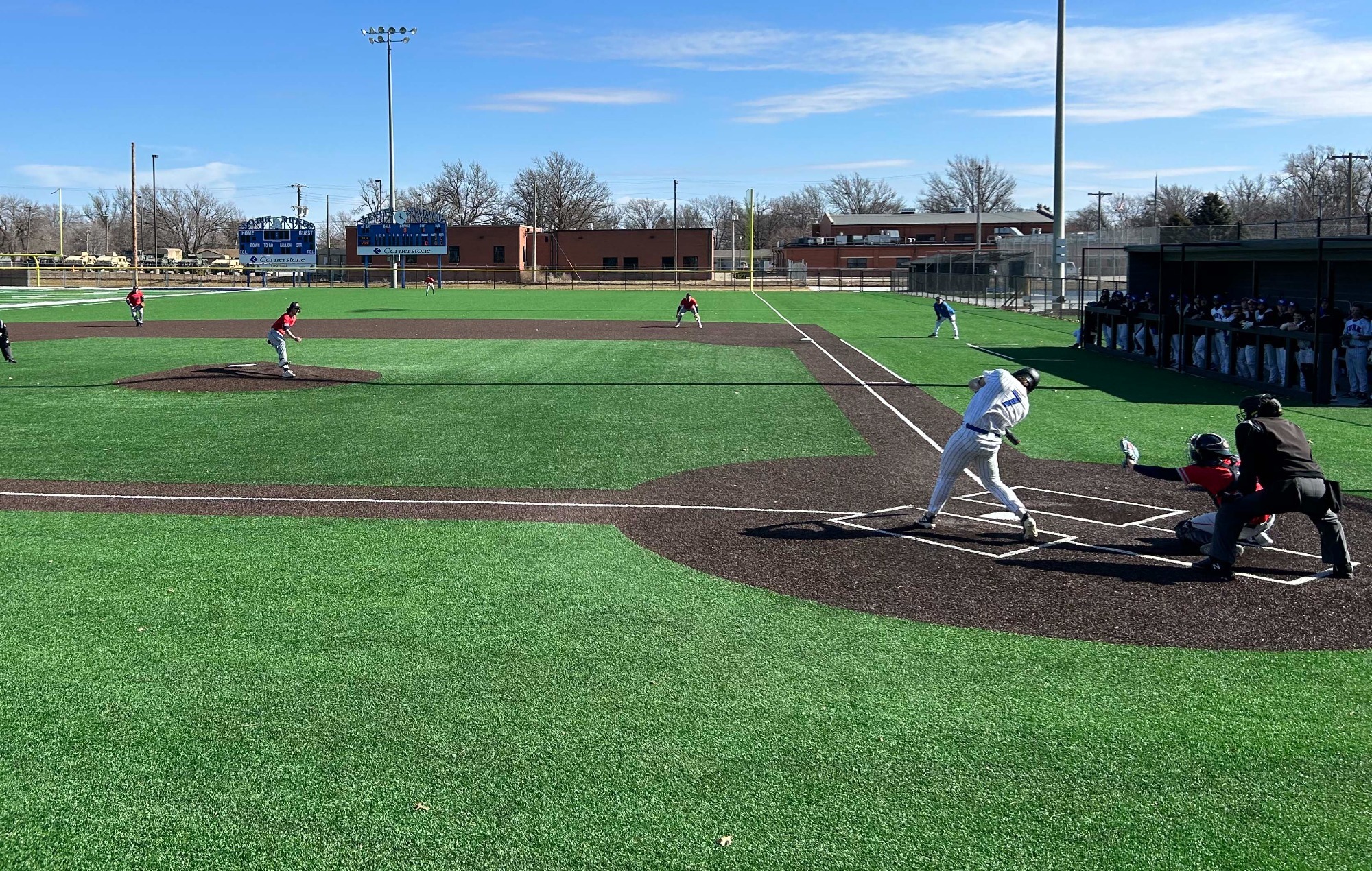 Heck swings at pitch during first home game of the season