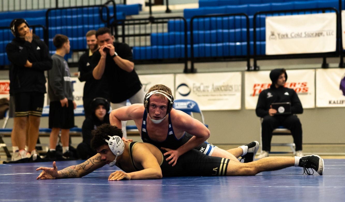 Davis controls his opponent on the mat