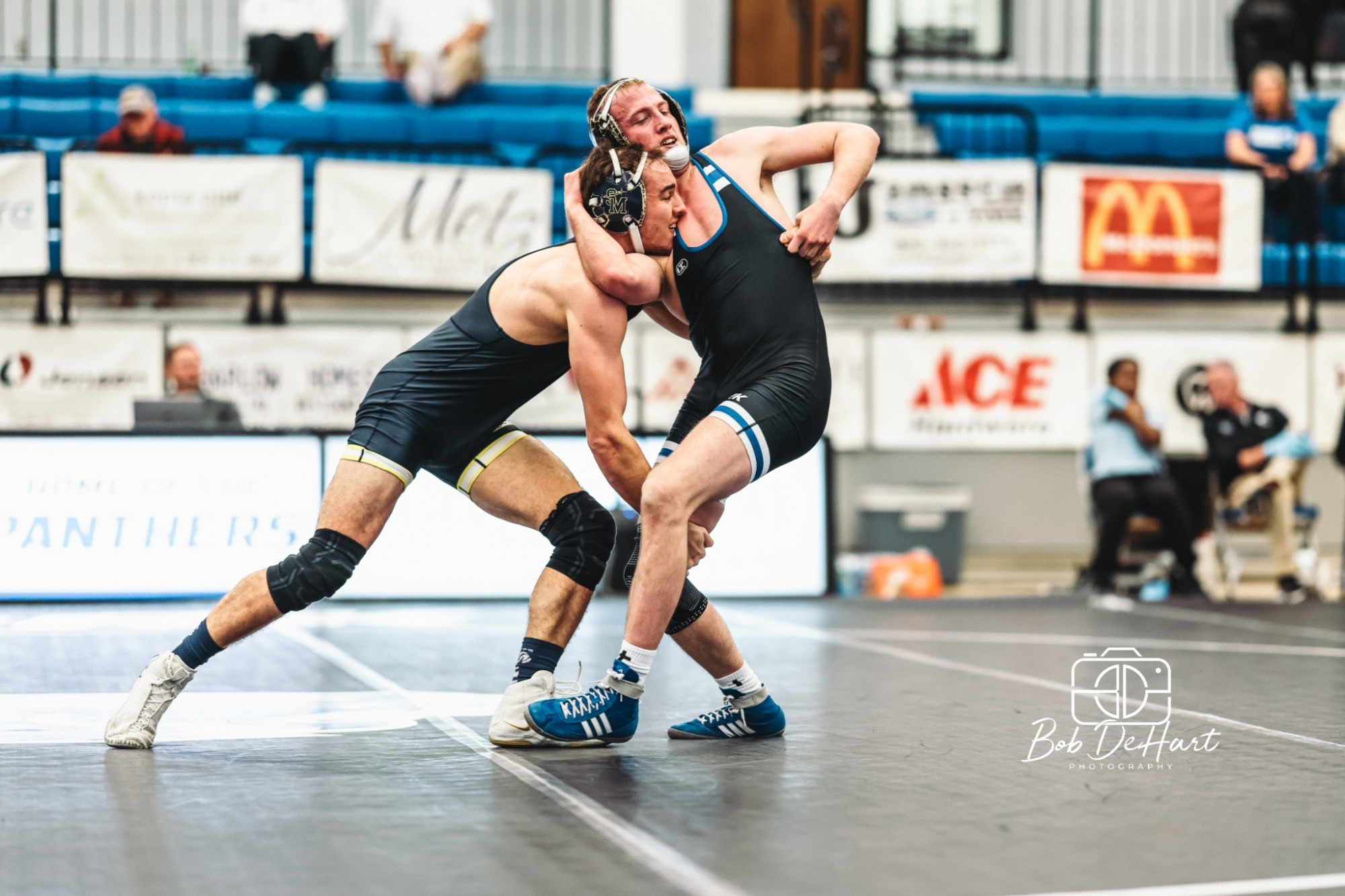 Caleb Davis wrestles against Spires
