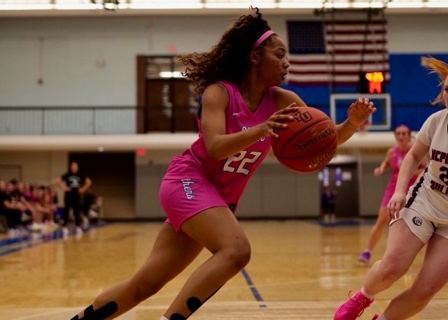 Brown drives the lane against McPherson