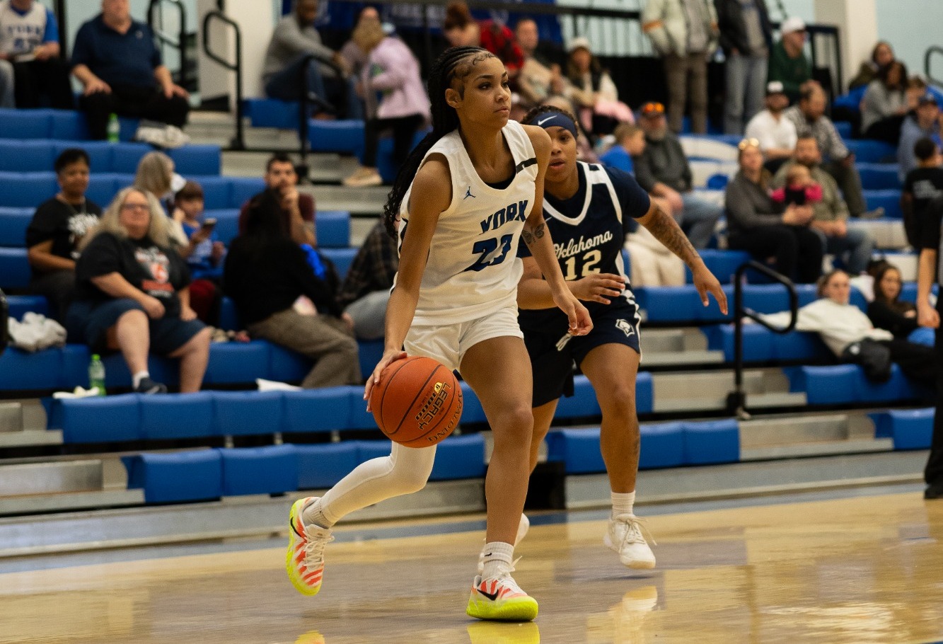 Page dribbles to the hoop