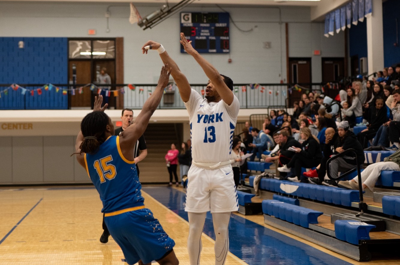 Ezell shoots a three-pointer