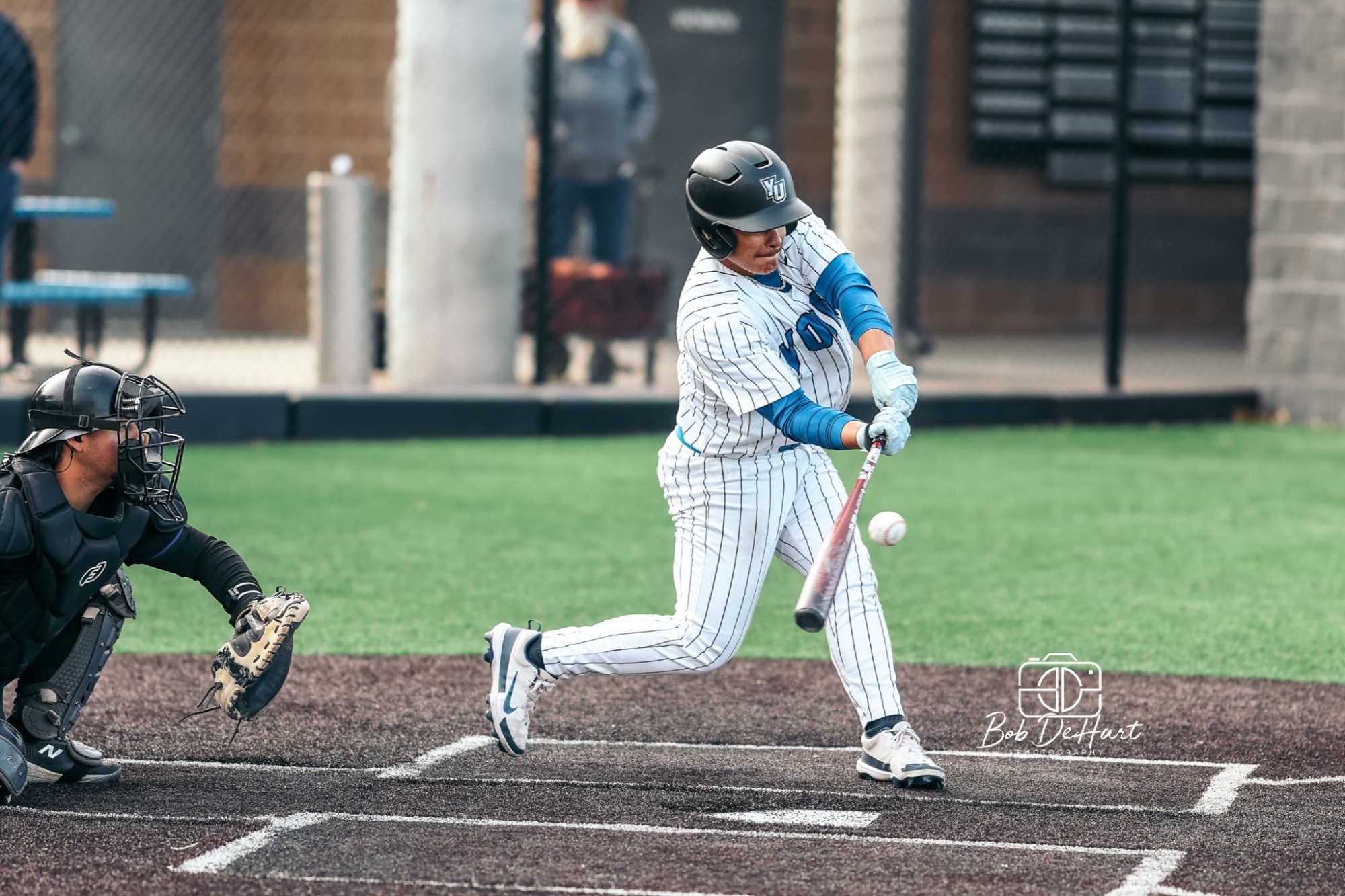 Martinez hits during game against Southwestern