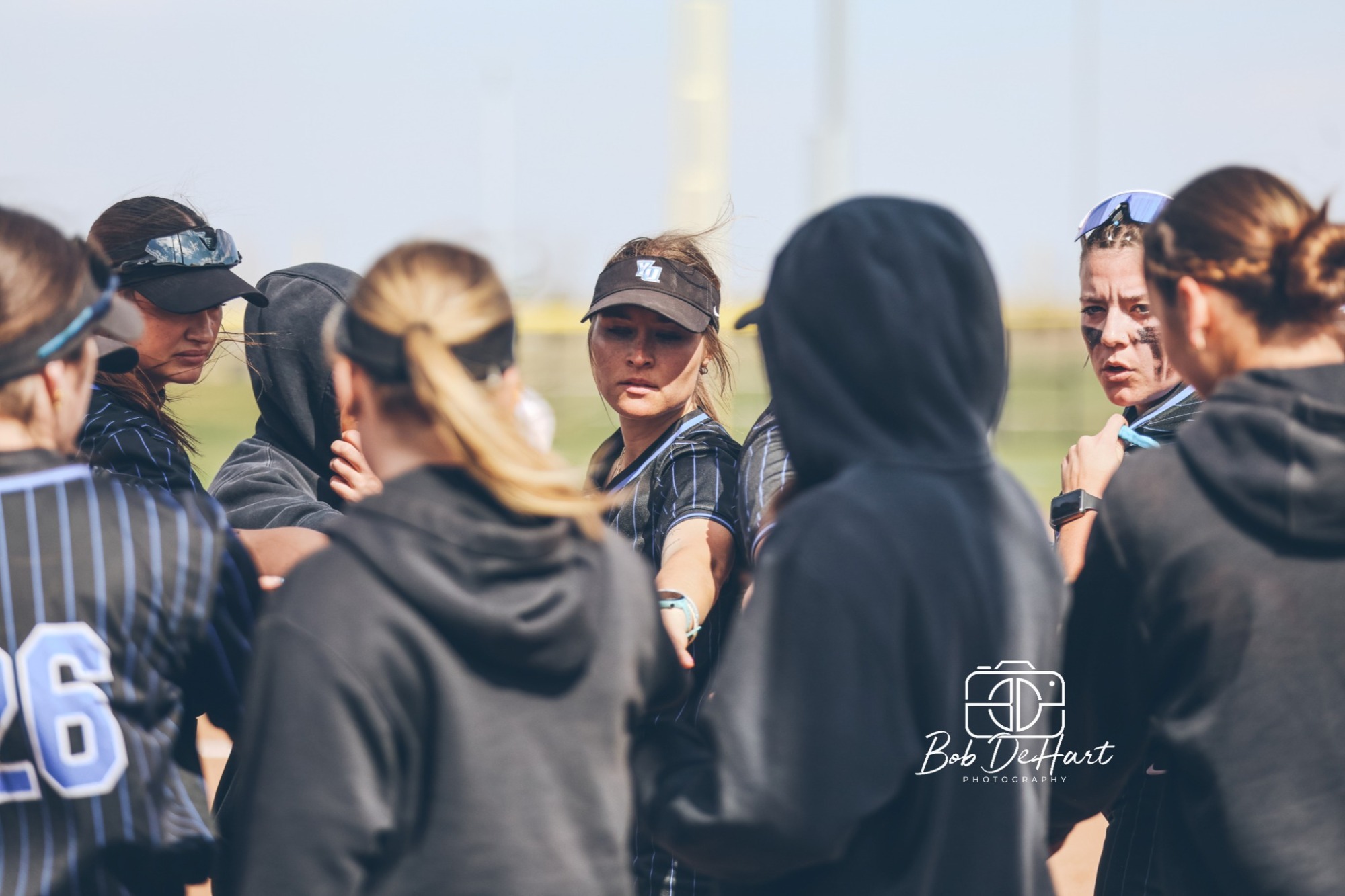 softball team in the huddle