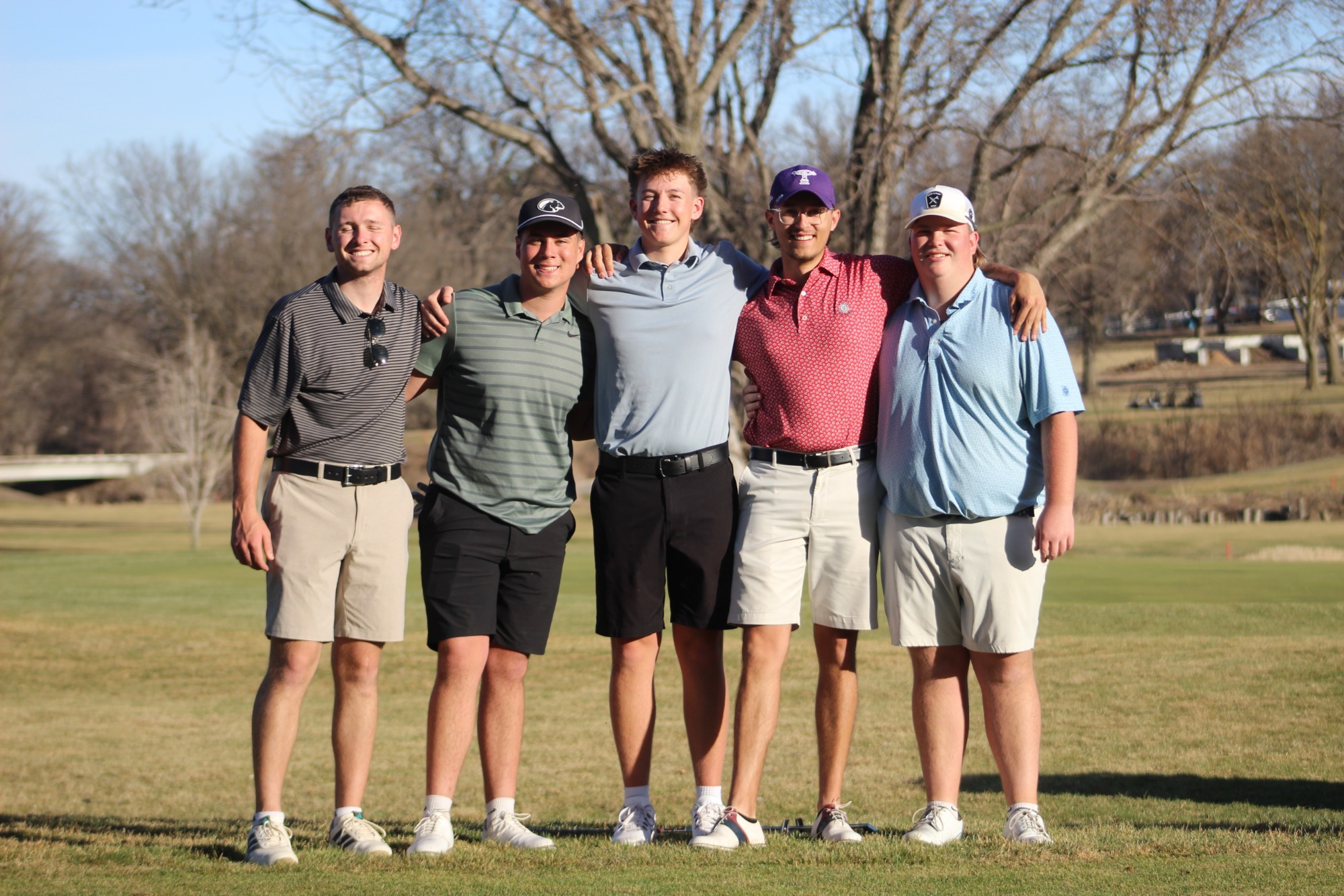 Team poses during practice round at KCAC Championship