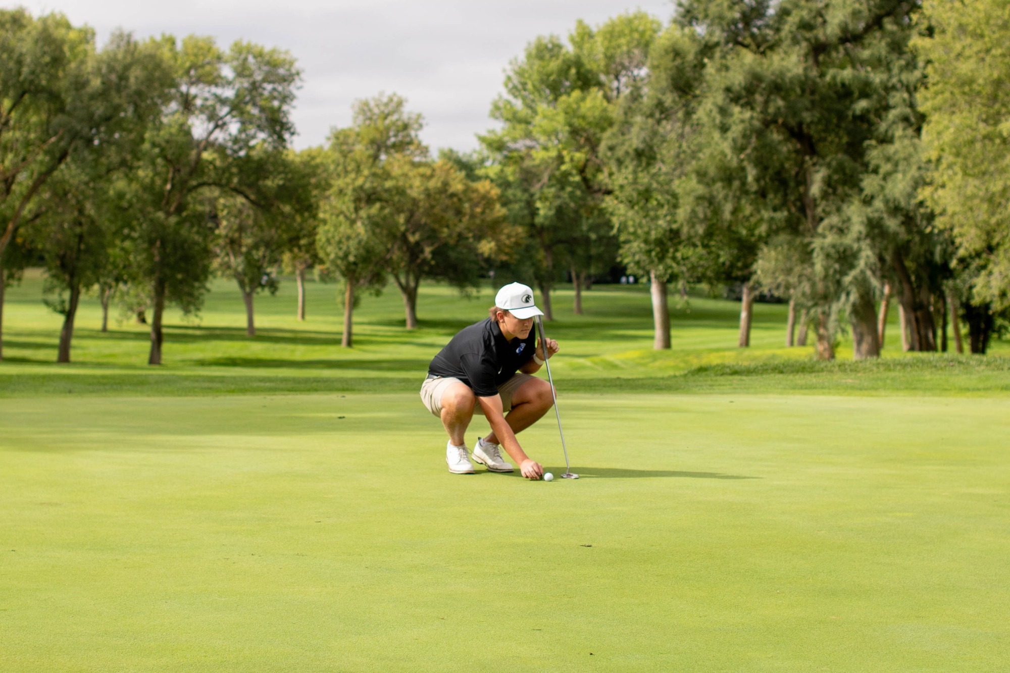 Flint lines up for the putt