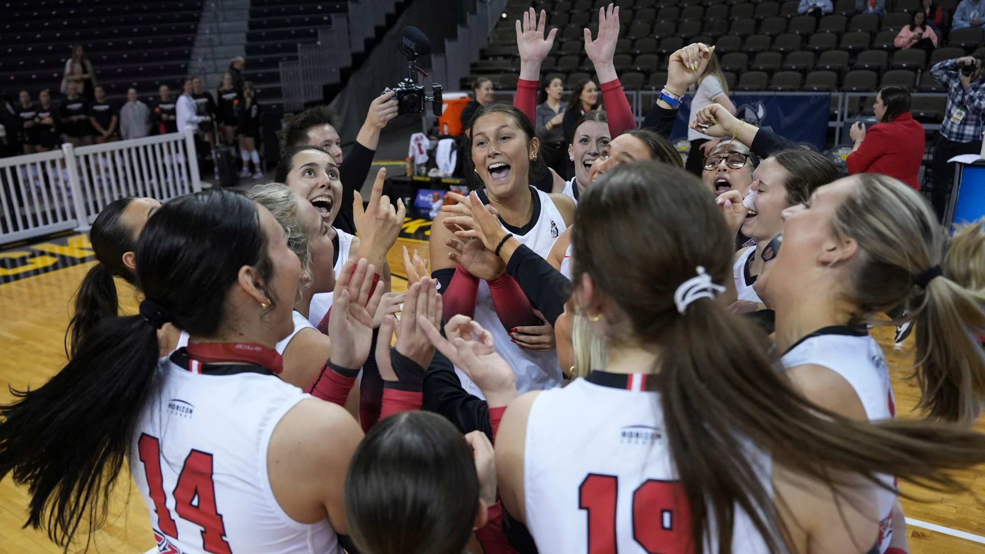 Youngstown State celebrates after its 3-2 victory in the quarterfinals of the 2025 Horizon League Volleyball Championship.