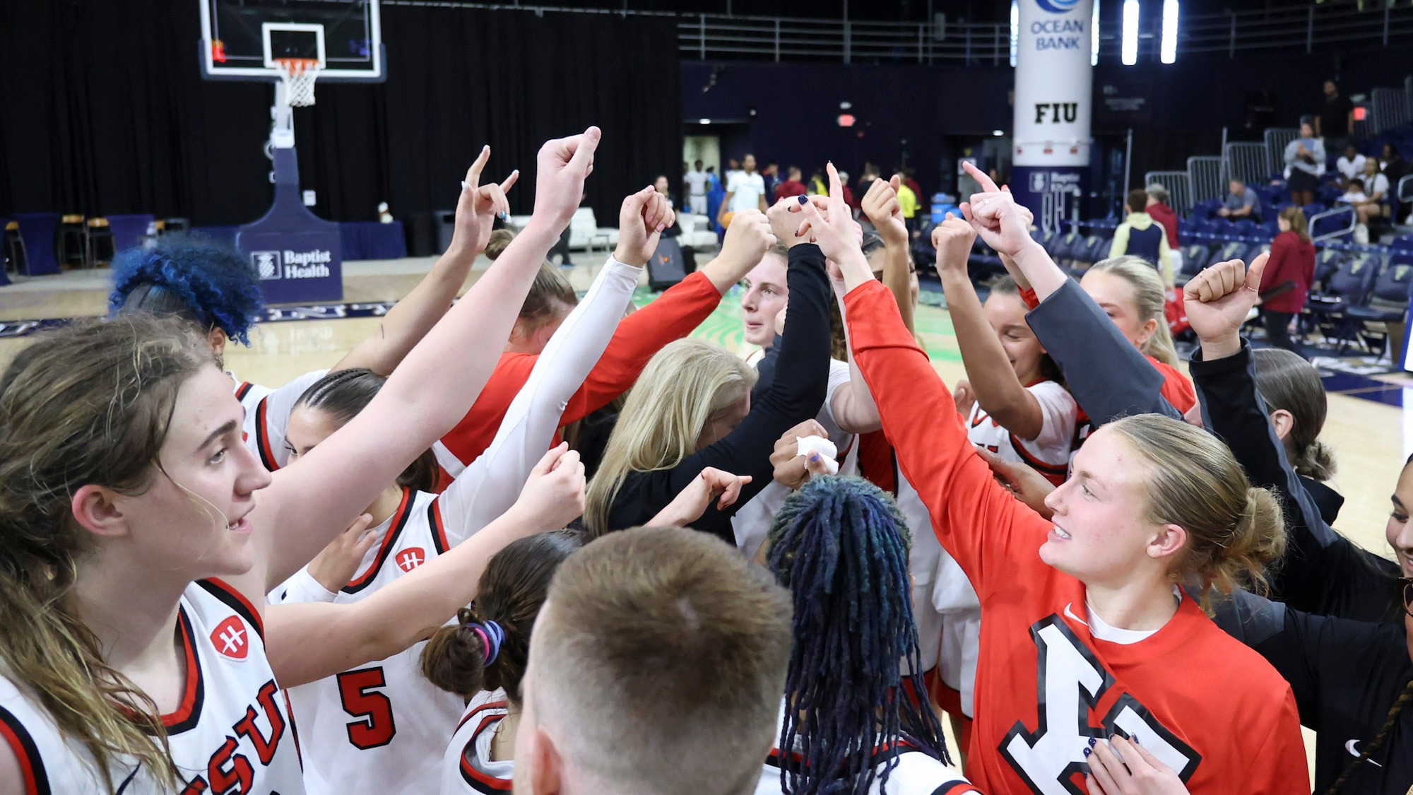 Youngstown State's women's basketball team huddles after its 72-69 victory over UMass on Dec. 20, 2025.