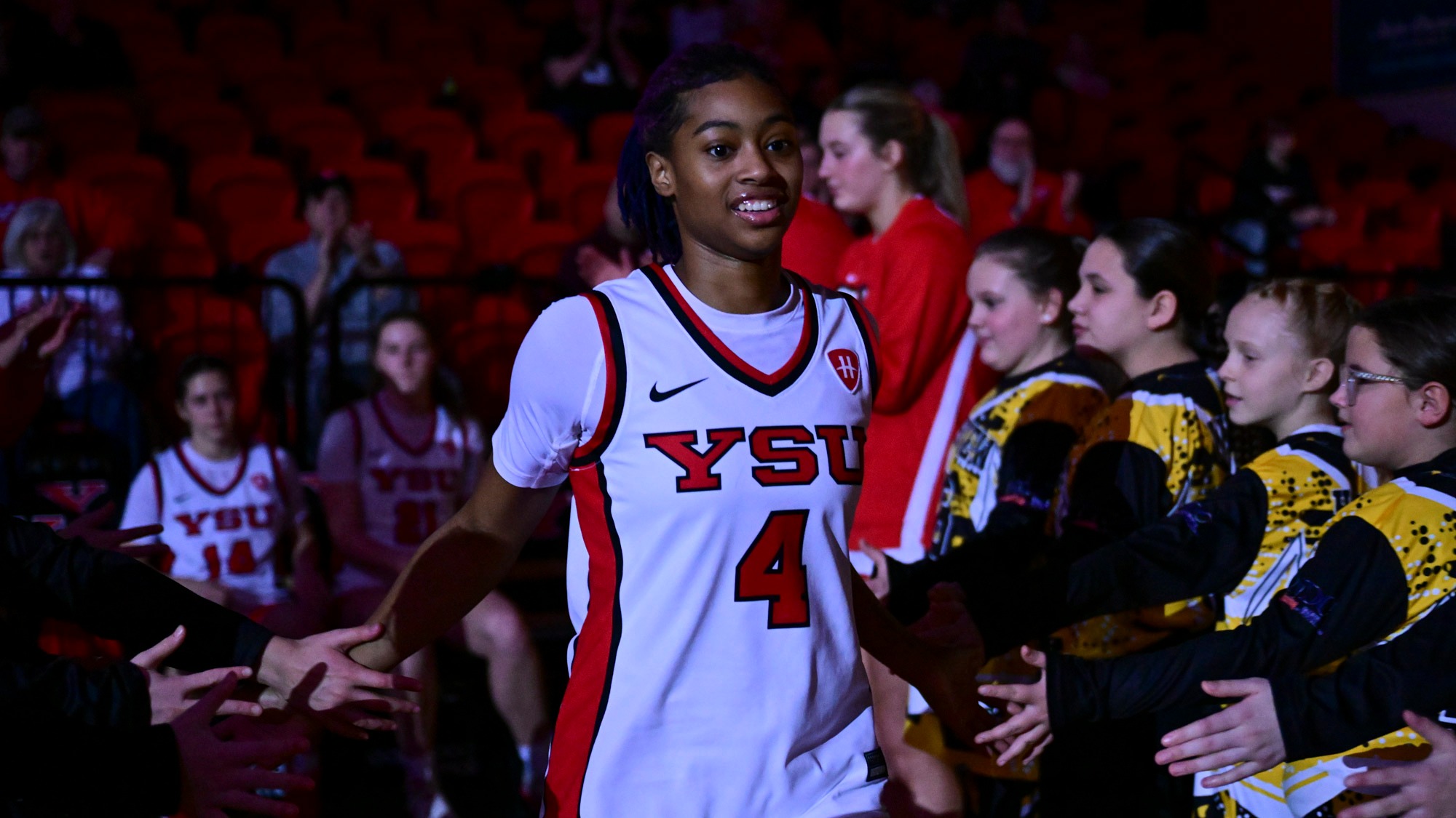 Erica King high fives teammates and a youth group during starting introductions. Youngstown State women's basketball vs. Purdue Fort Wayne on Jan. 10, 2026. Photo by David Dermer.