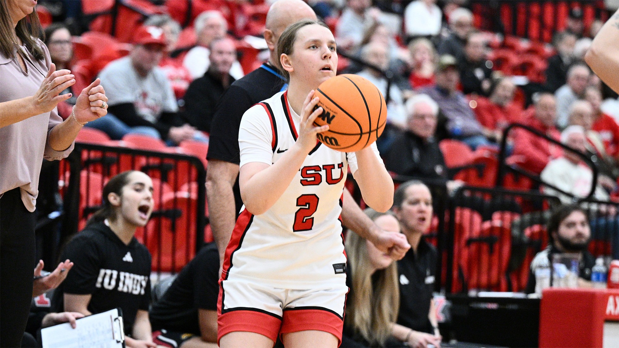 Danielle Cameron shoots in front of the IU Indy bench.