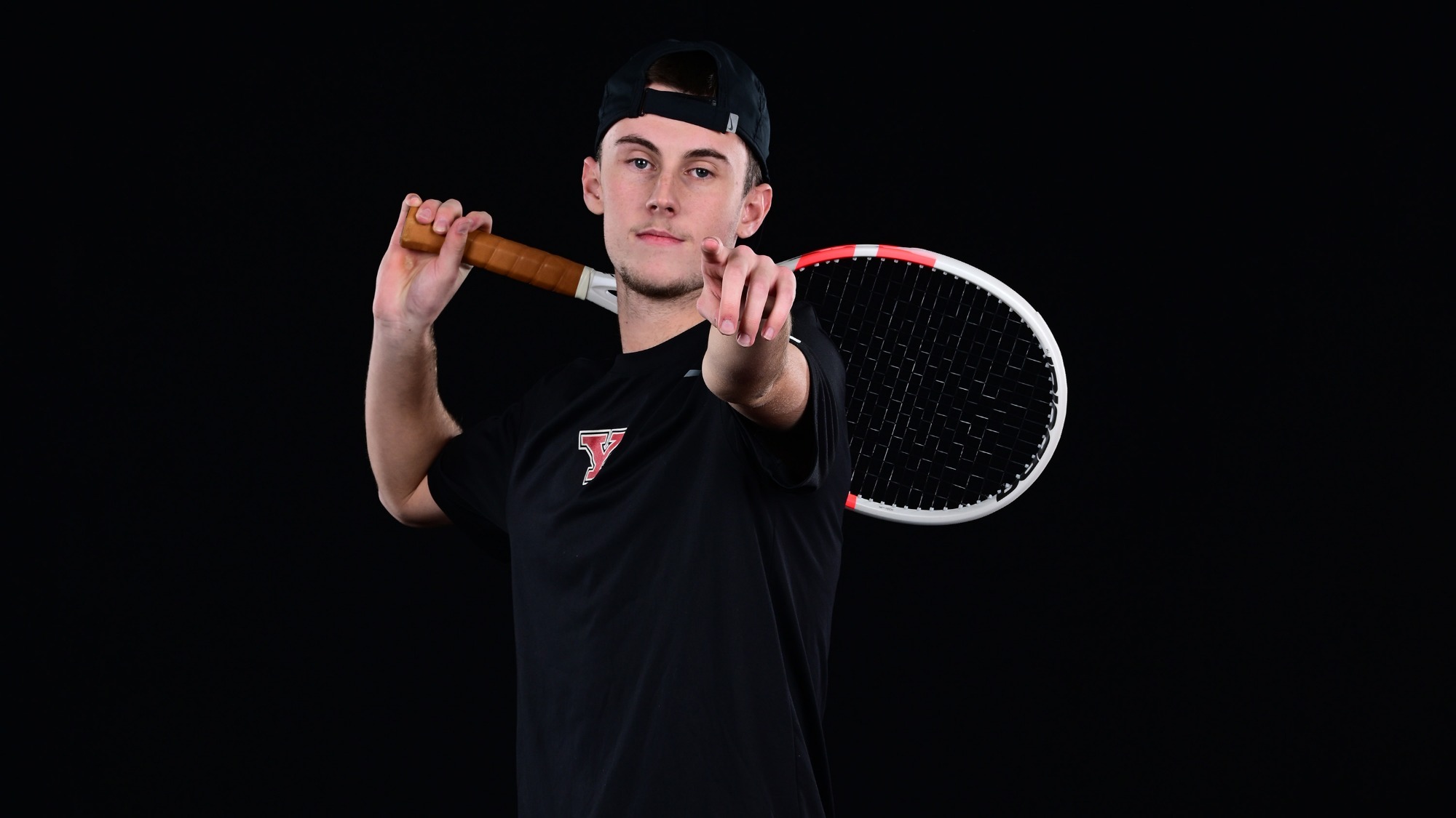 Rafael Le Fur points forward while holding a racquet