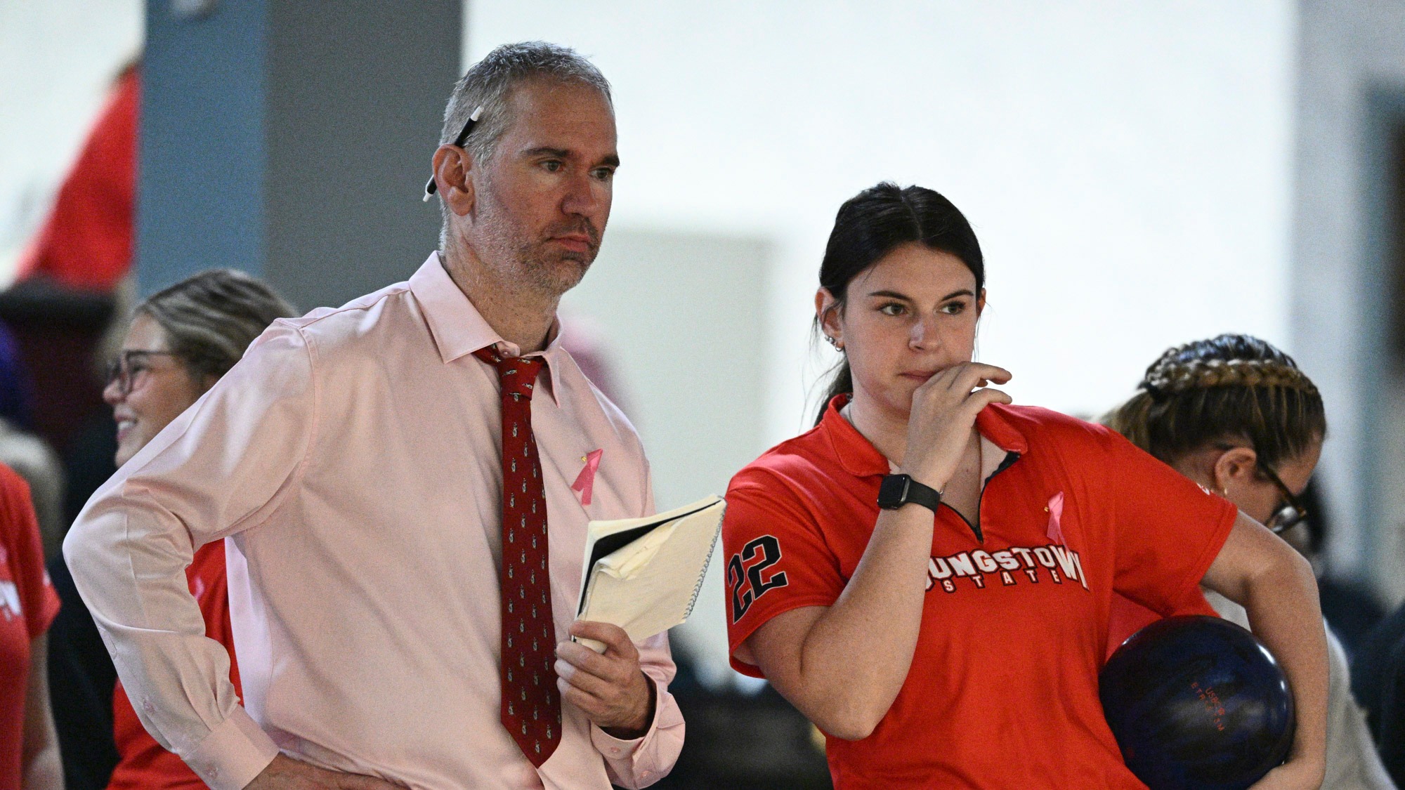 Head Coach Doug Kuberski and Kara Beissel look at the lanes as Youngstown State's bowling team competes at the 2025 Chelsea Gilliam Penguin Classic on Oct. 19, 2025. Photo by Robert Hayes.