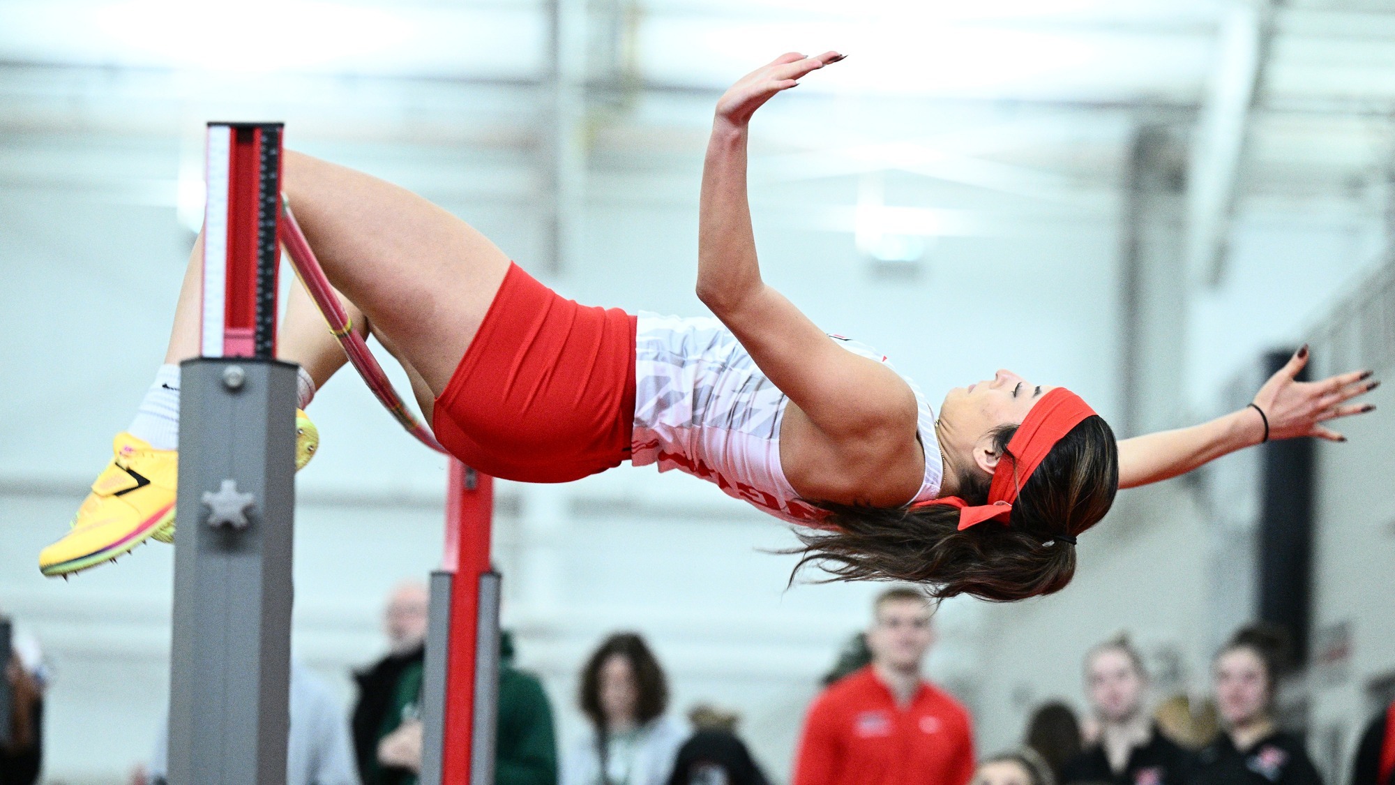 Mia Dionsio clears the high jump