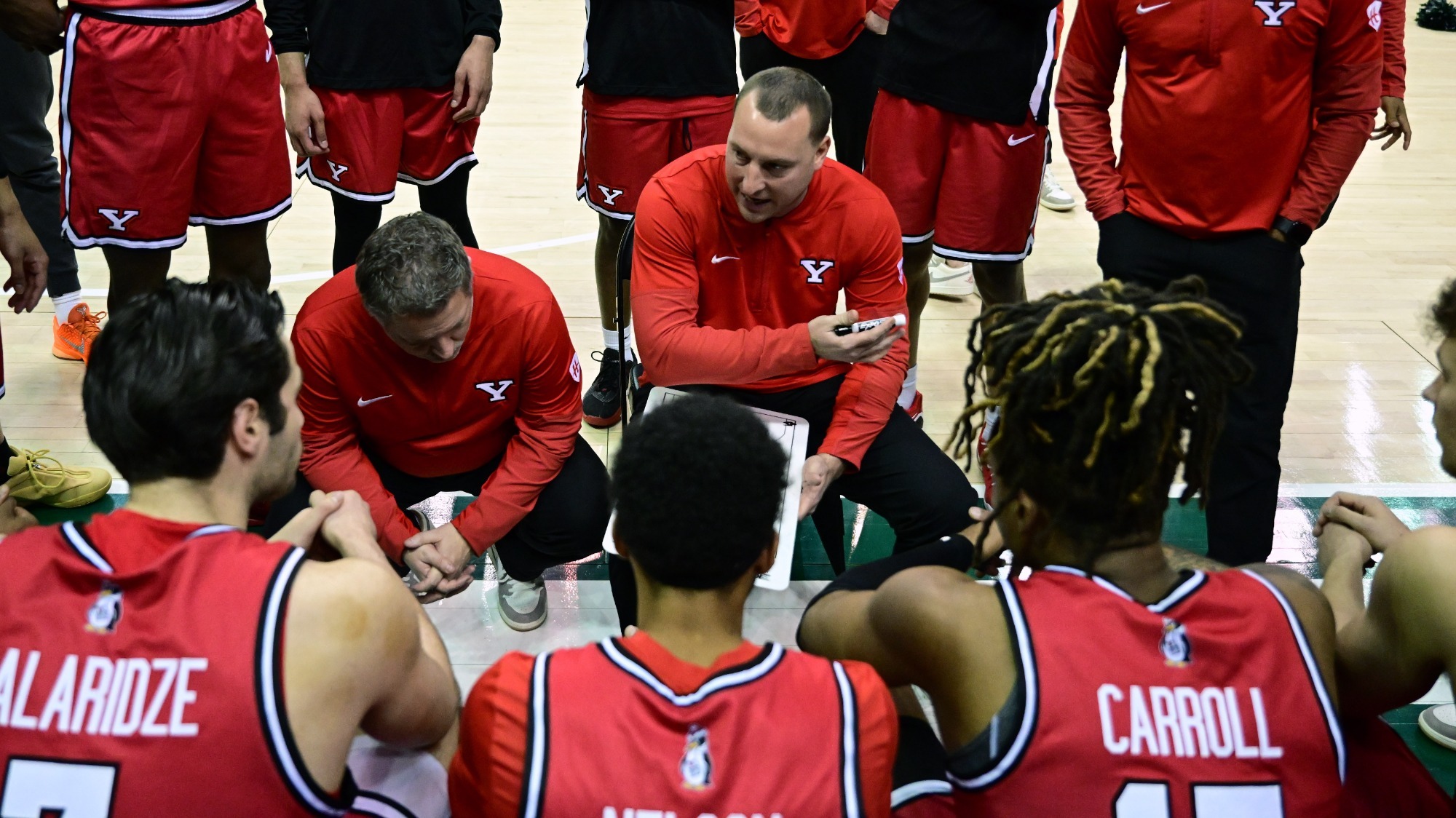 Men's Basketball Bench Huddle