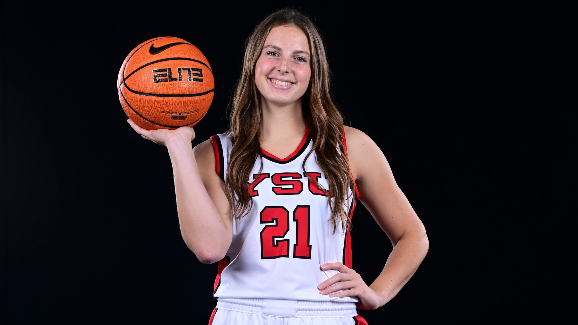 Sophia Gregory holds up a basketball at the 2025-26 YSU Women's Basketball Photo Day.