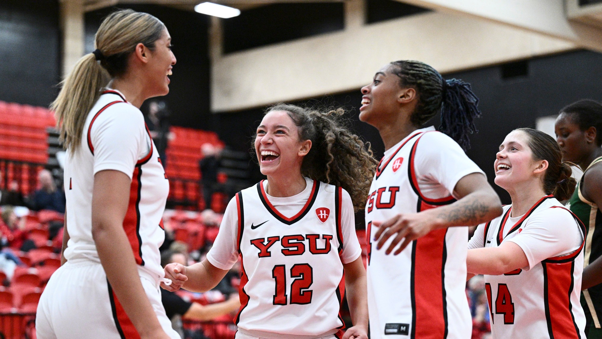 Paulina Hernandez celebrates with teammates Dacia Lewandowski, Erica King and Casey Santoro after a basket against Wright State on Dec. 16, 2025.