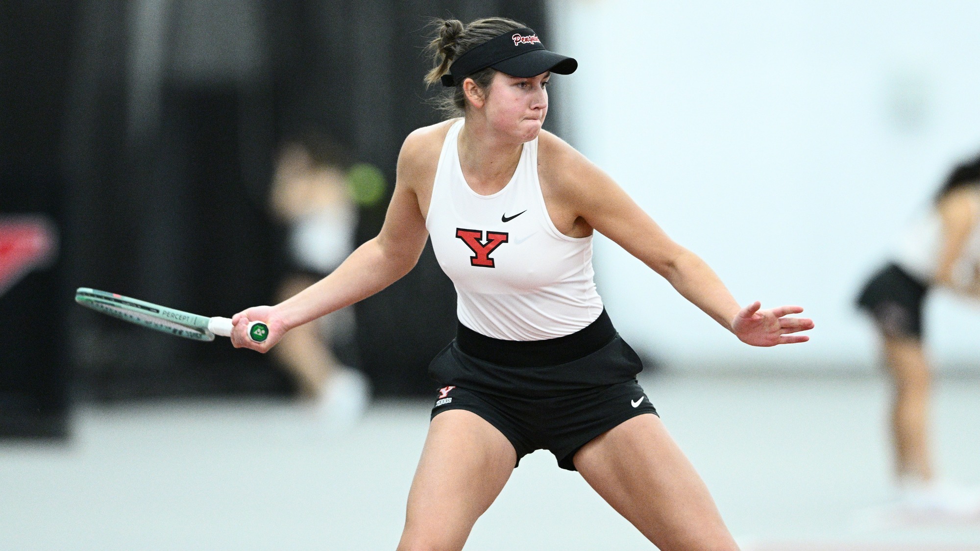 Yeseniia Ovcharova swings a tennis racquet