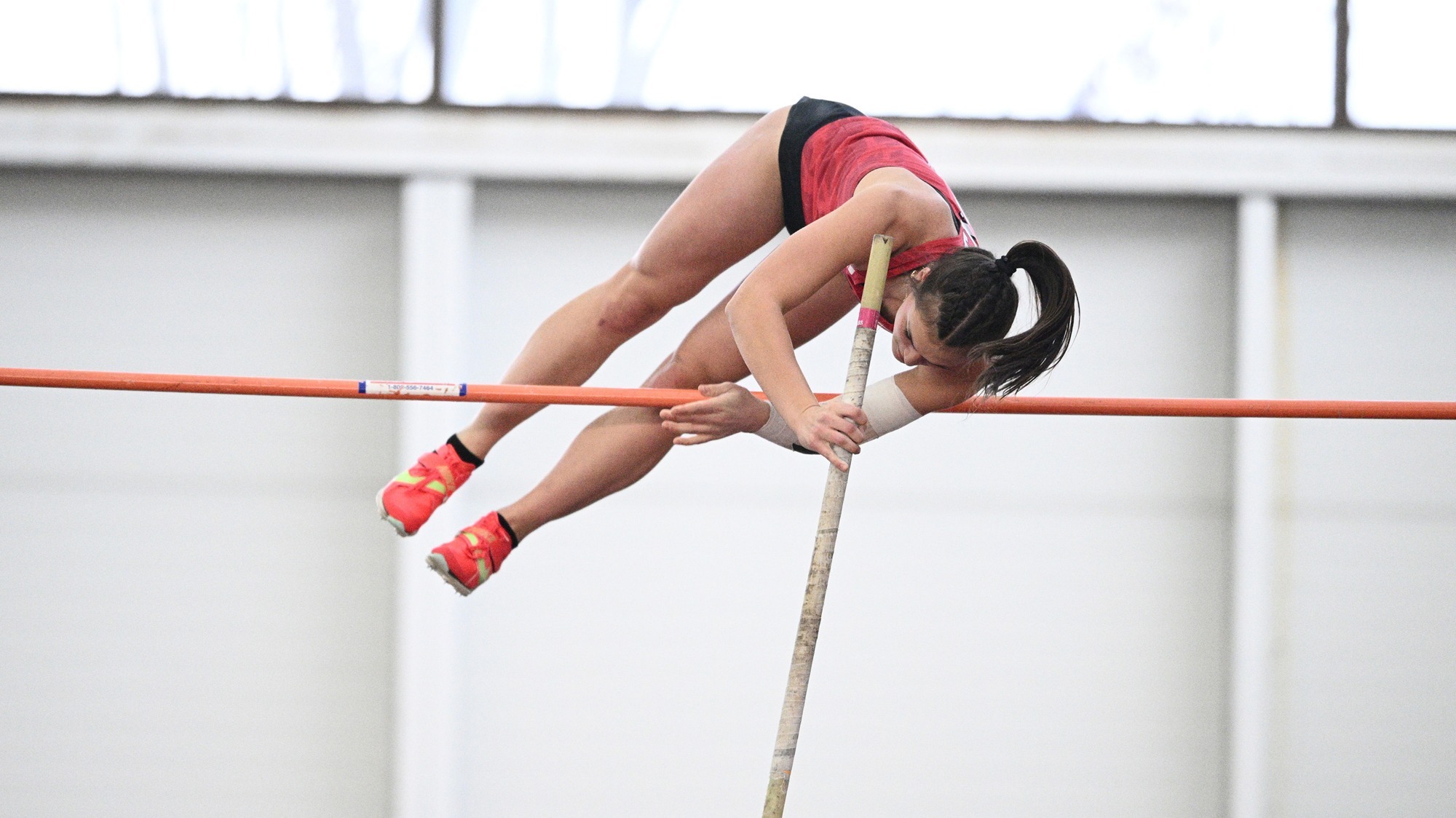 Ainsley Hamsher clears the bar in the pole vault.