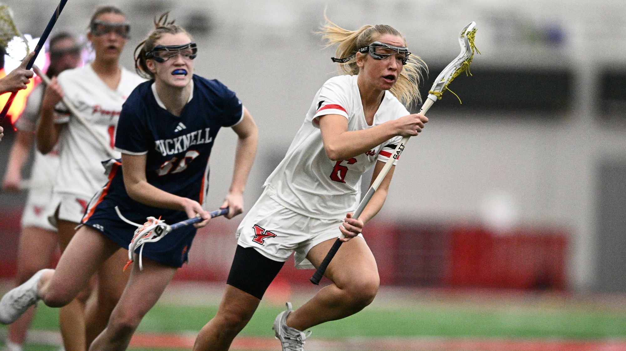 YSU Lacrosse vs. Bucknell - Lexy Koslakiewicz cradles the ball in a lacrosse stick