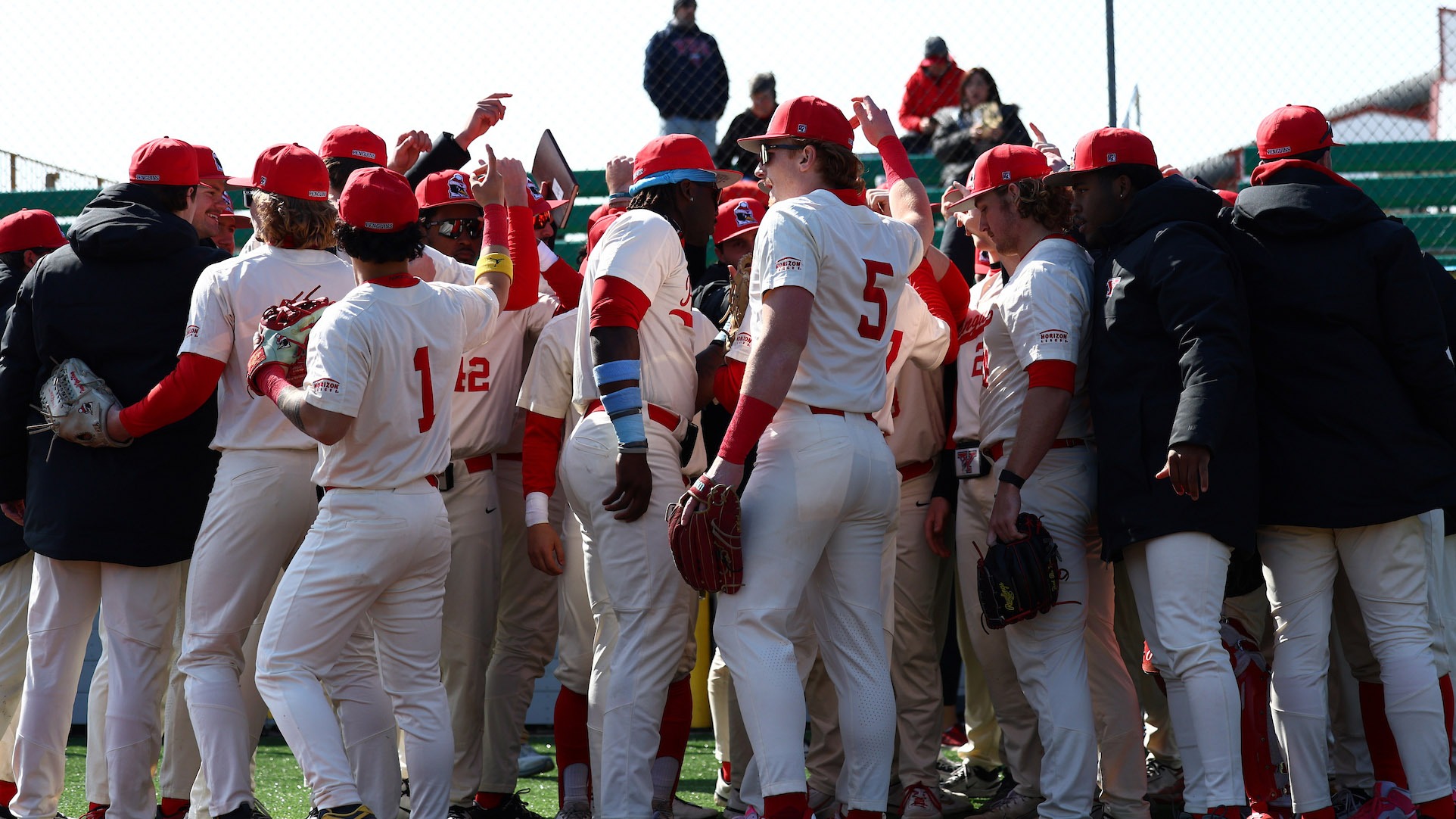 YSU baseball players huddle together before taking the field for a game vs. Oakland at Pullman Park on March 14, 2026 (Photo by Bryson Chavez)