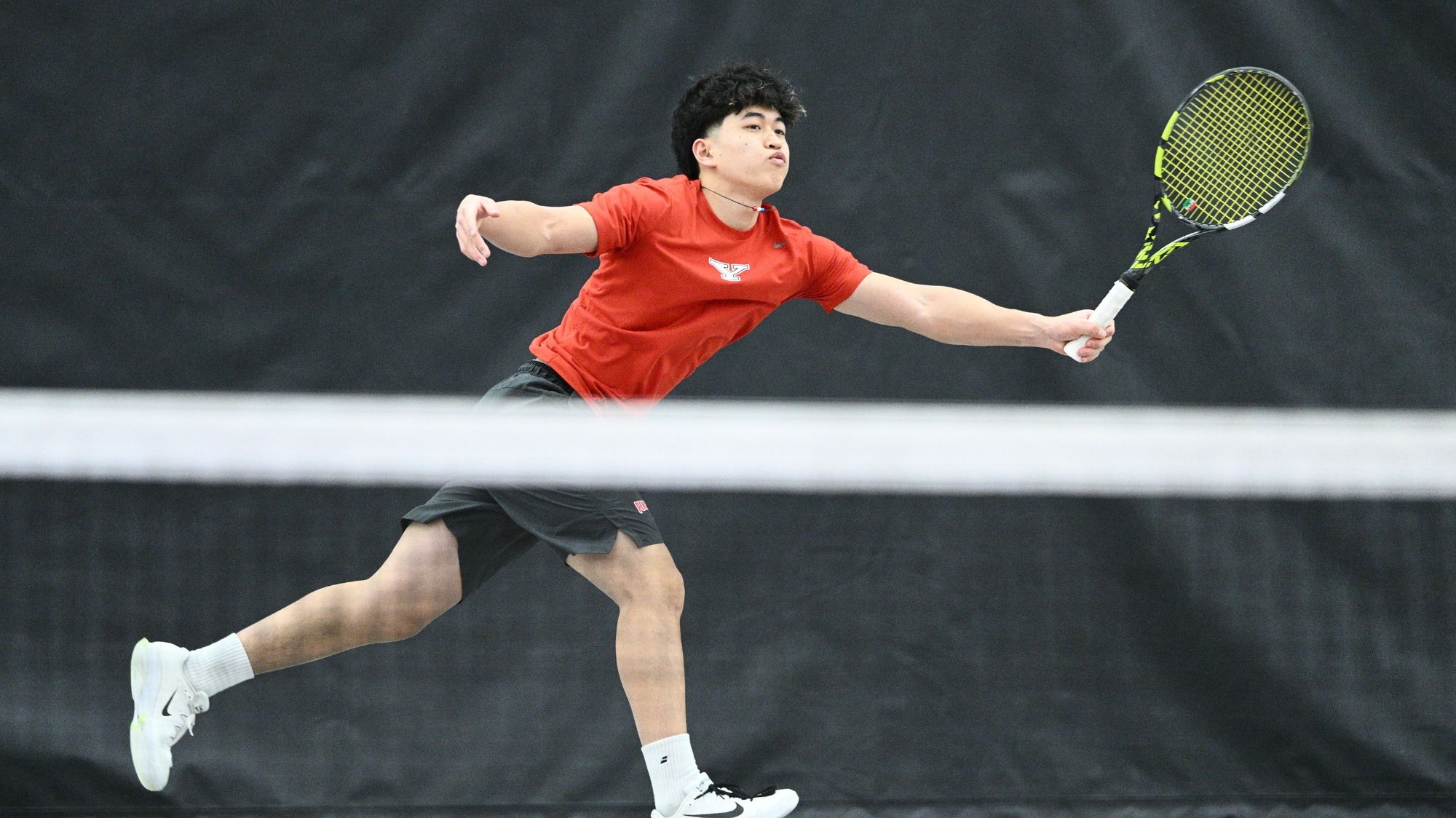 Takamasa Mishiro returns a serve