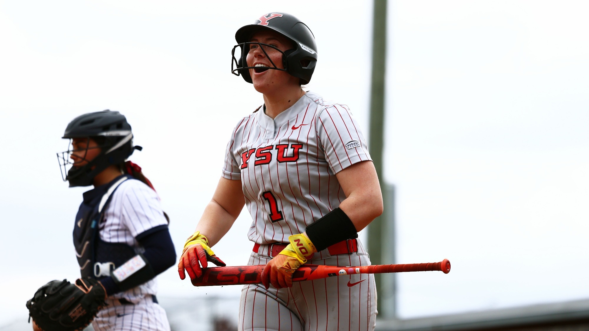 Kennedy Dean returns to the dugout after scoring a run