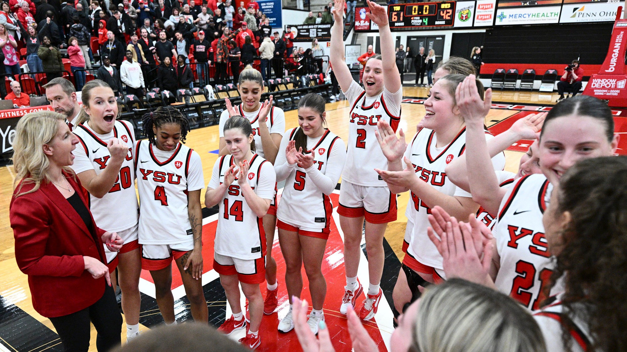 Youngstown State's women's basketball team celebrates its win over Maryland Eastern Shore in the Postseason WNIT.