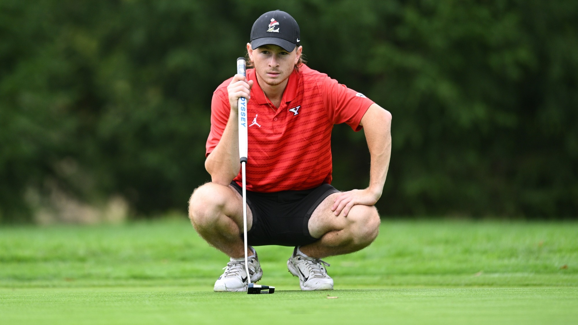 Josh Weiner reads the putting green for YSU at the Tom Tontimonia Invitational at Pine Hills Golf Club on Oct. 1, 2024 (Photo by Robert Hayes)