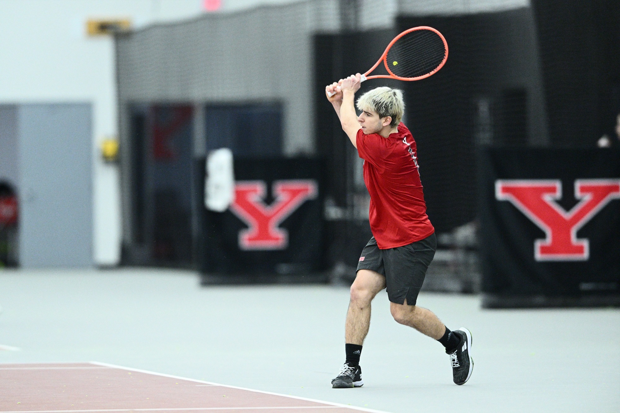 Matteo Ceradelli returns a tennis shot