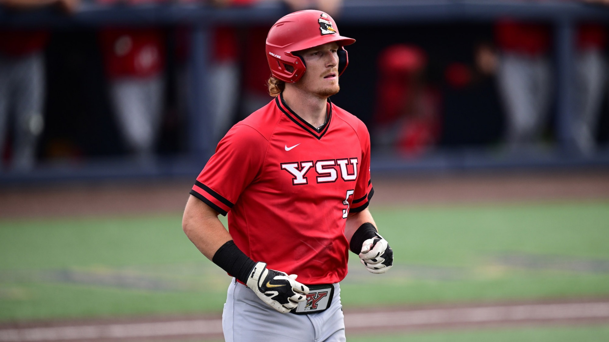 Brady Shannon jogs to first base after drawing a walk for YSU during a baseball game at Akron on April 14, 2026 (Photo by Dave Dermer)