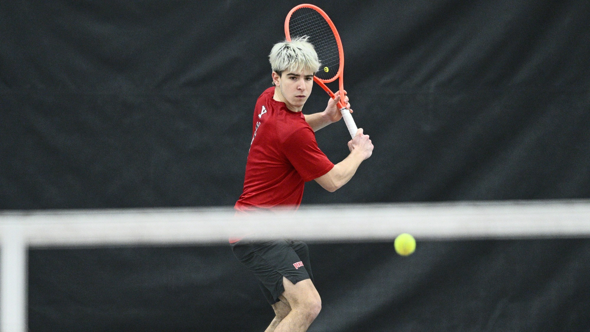 Matteo Ceradelli prepares to return a tennis ball
