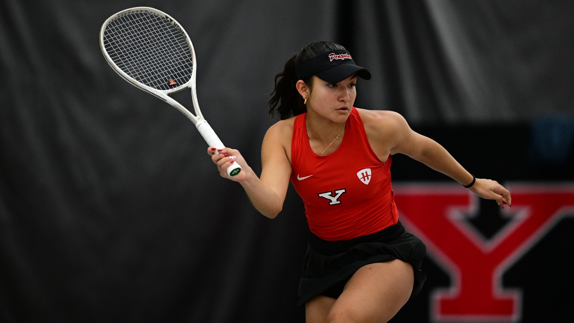 Lorena Cedeno prepares her racquet to return a tennis shot