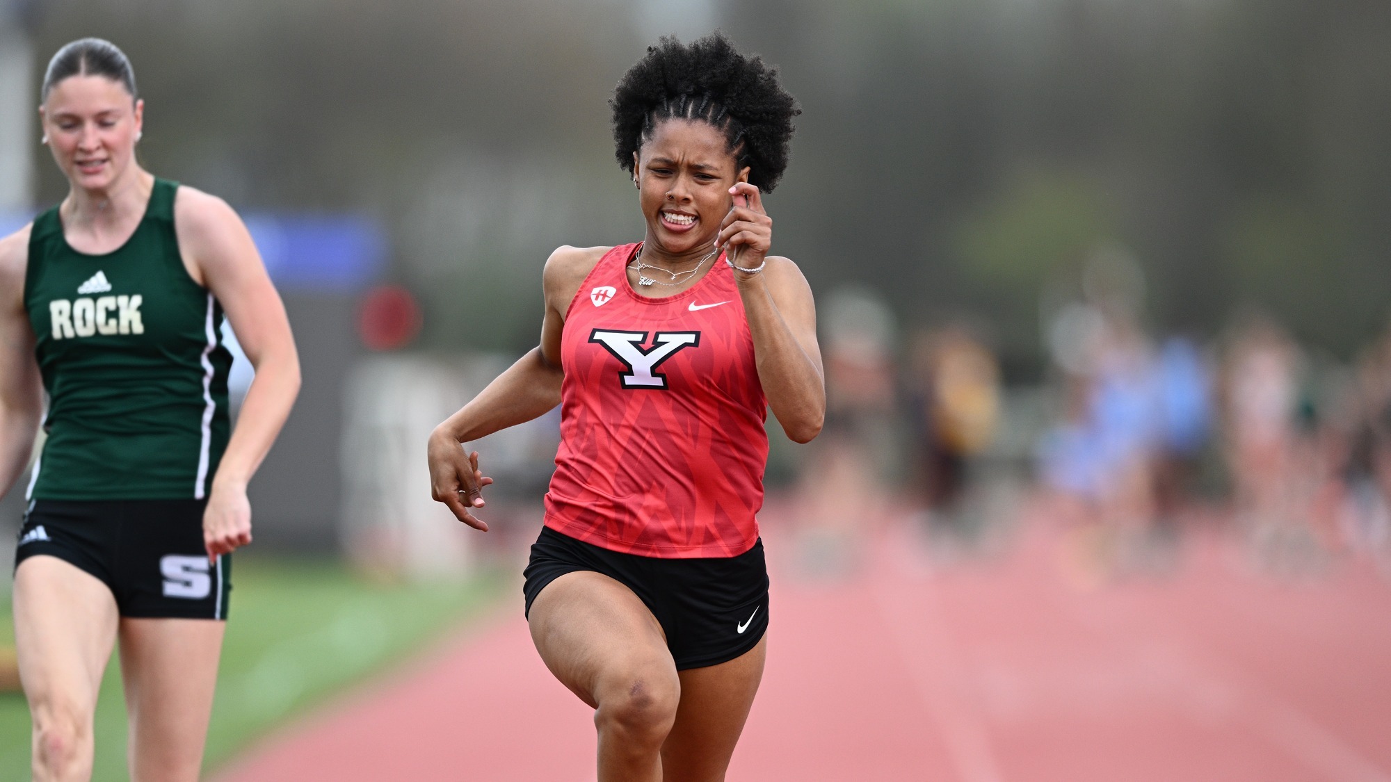 Elle Pearsall runs the 100m at the SRU John Papa Invitational