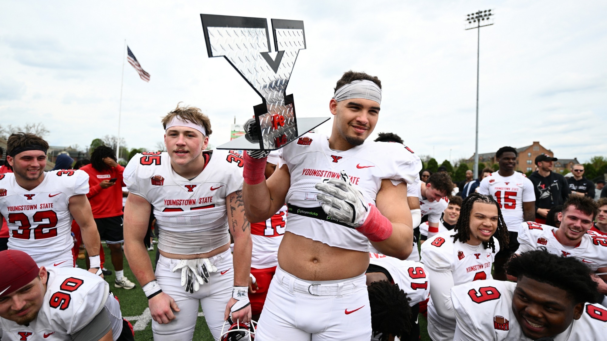 Mike Wells holds the winning Y after the defense won the Red-White Spring Game