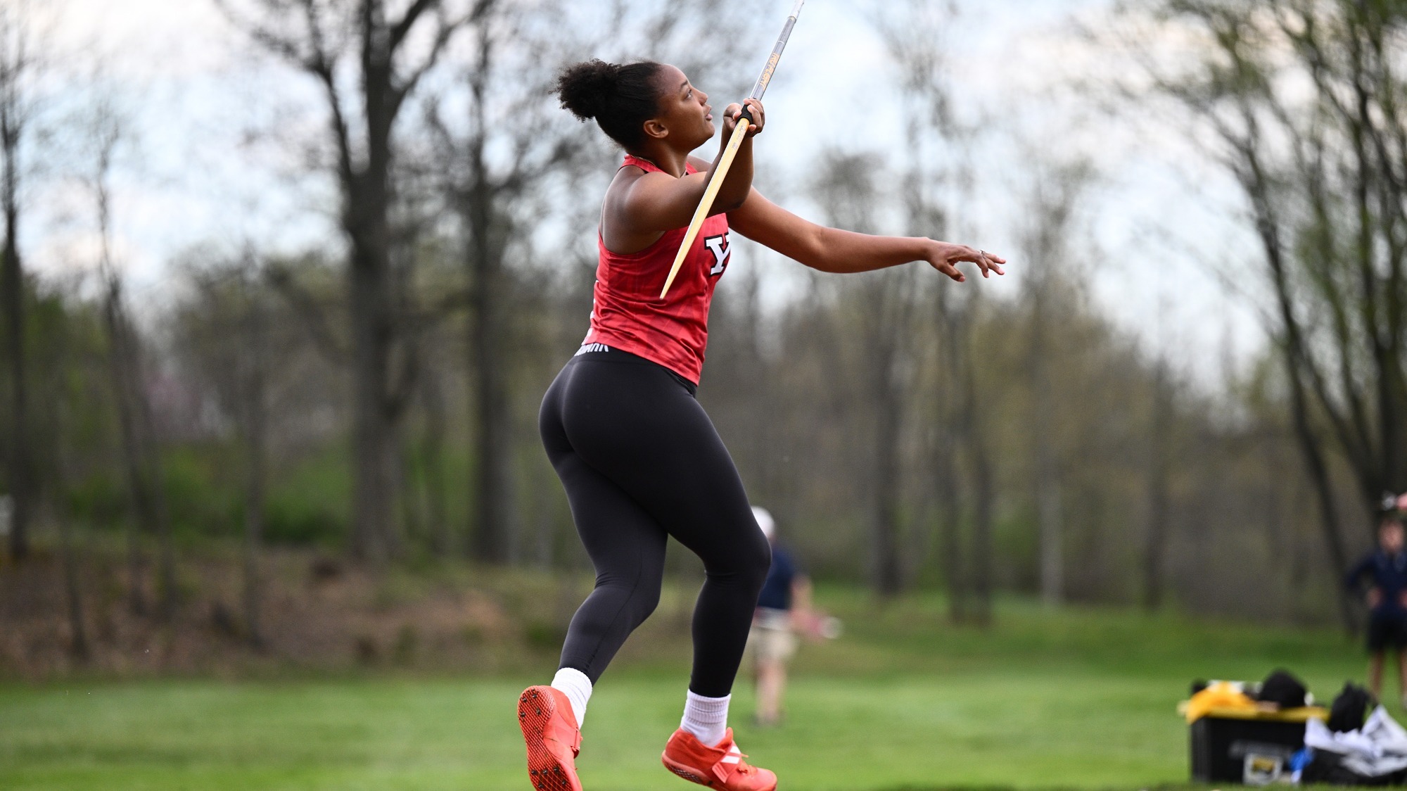 India Bailey throws the javelin from a behind the runway angle