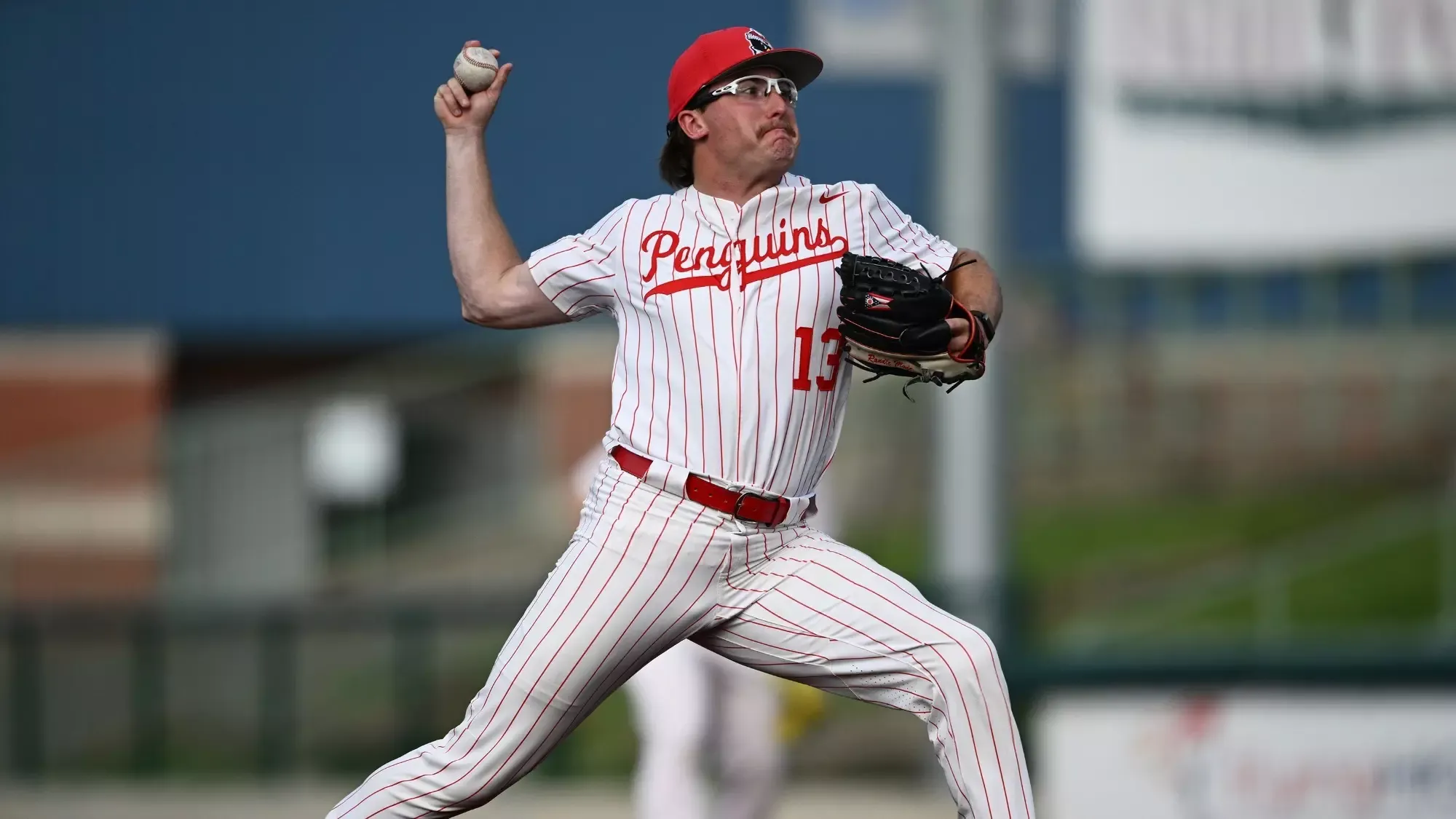 Lane Rhodes delivers a pitch from the mound at 717 Credit Union Field at Eastwood