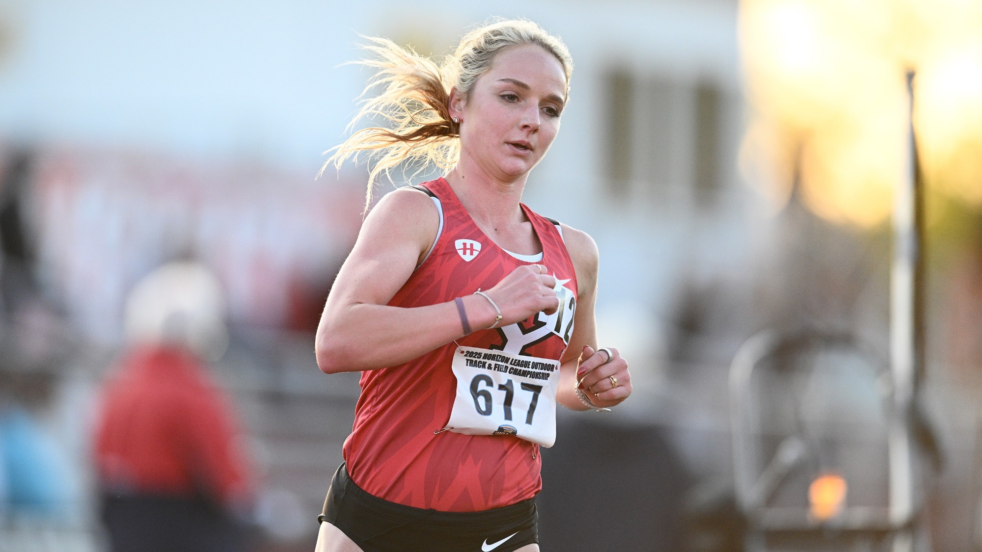McKinley Fielding runs at dusk at the 2025 Horizon League Outdoor Championships