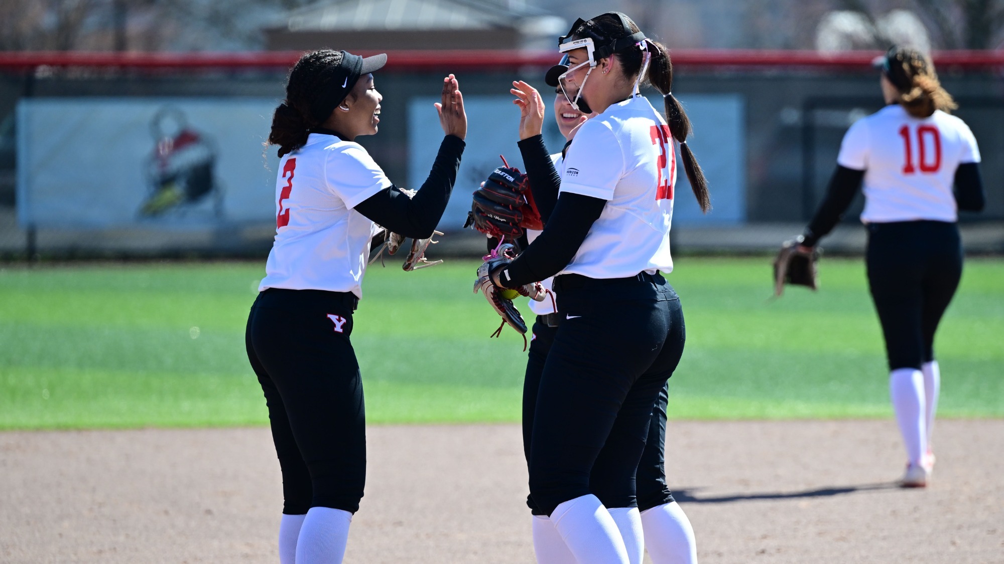 Youngstown State softball players meet at the pitching circle