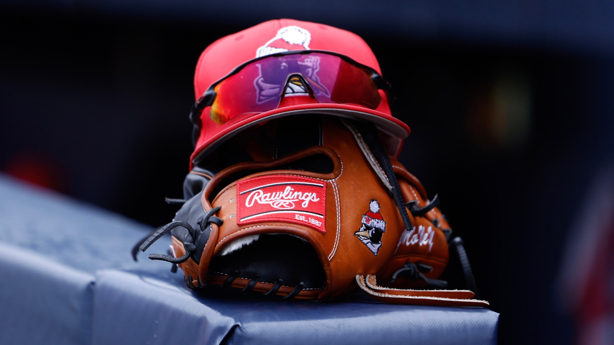 YSU Baseball hat and glove sit near the dugout before a game at Pitt on March 25, 2026 (Photo by Bryson Chavez)