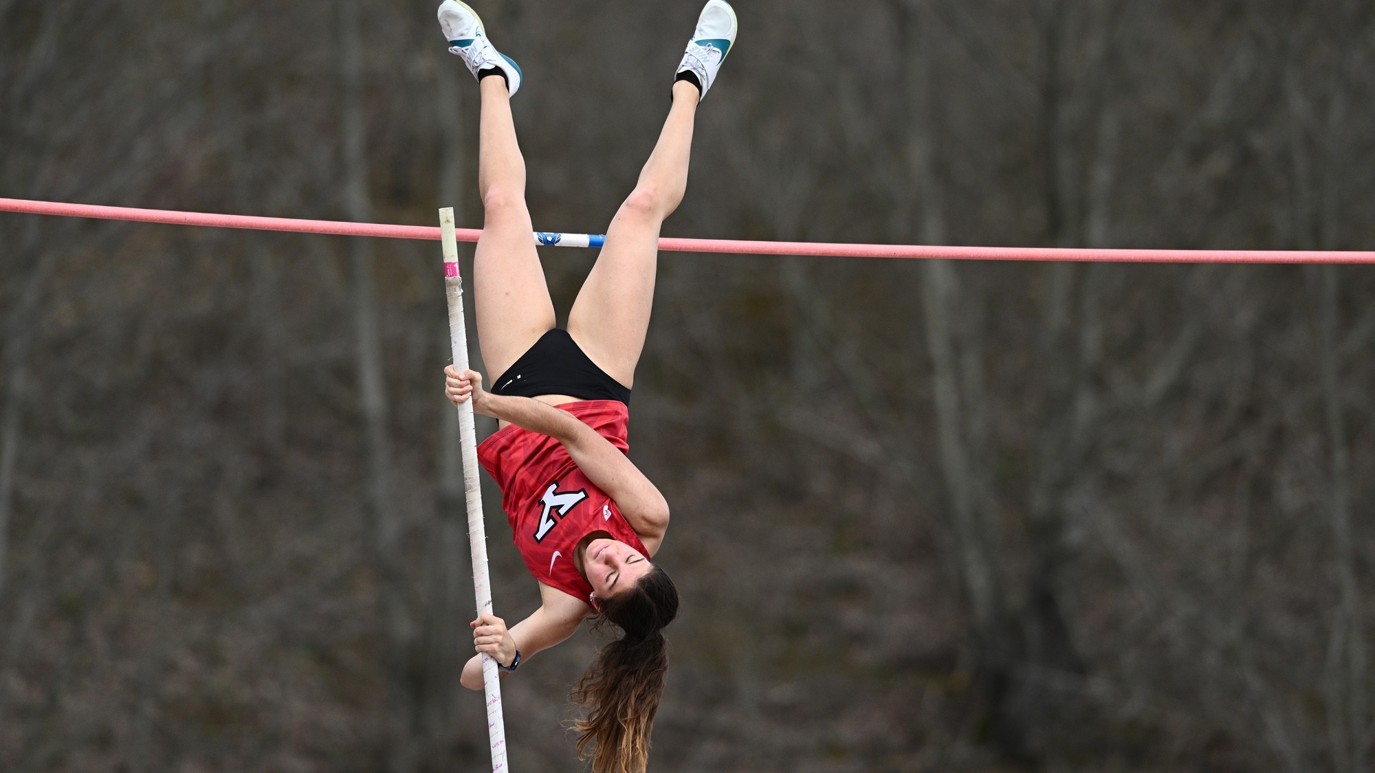 Kailtyn Eger clears the bar during a pole vault attempt at the SRU Dave Labor Invite