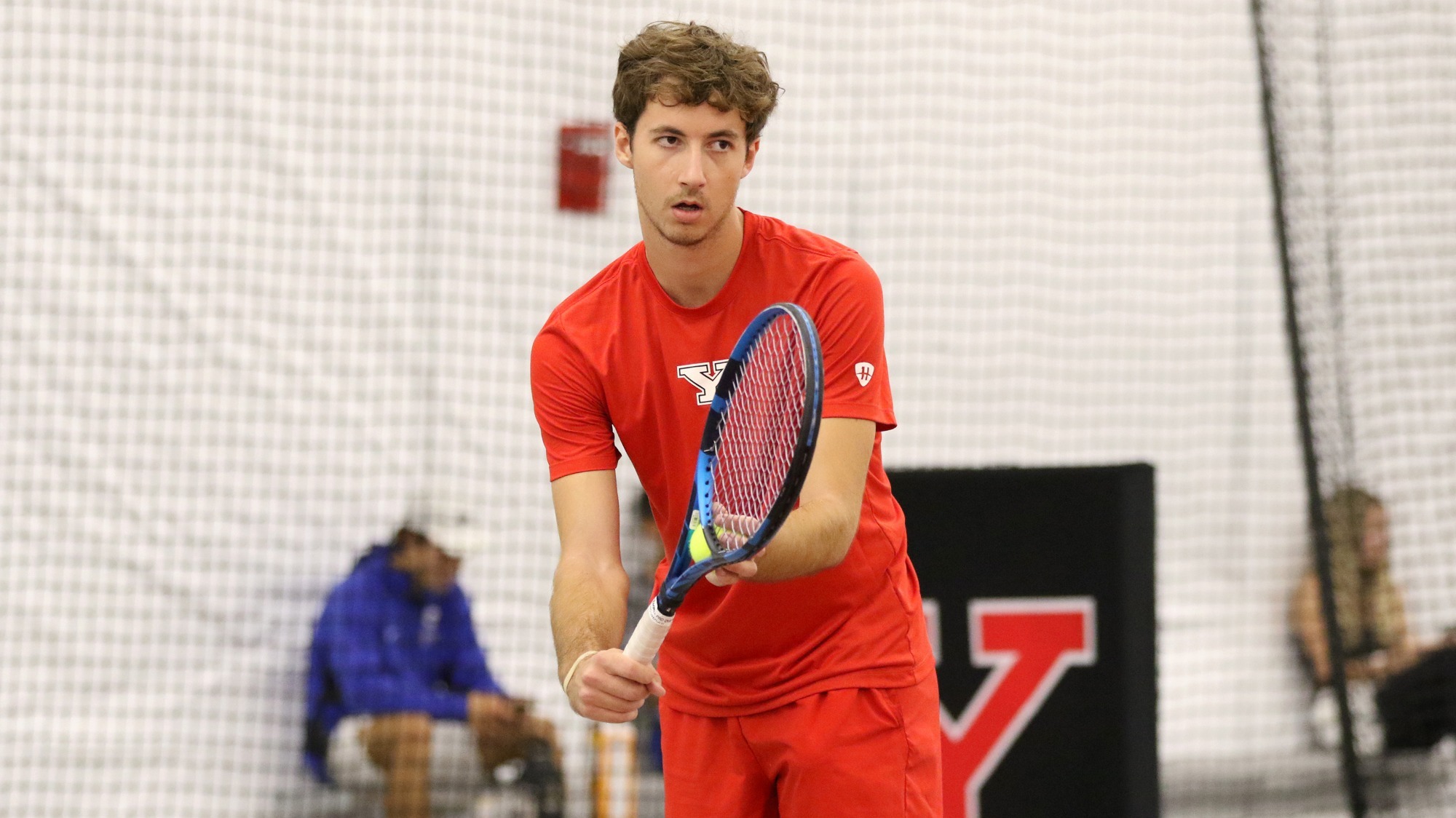 Alexis Maulouet prepares to serve