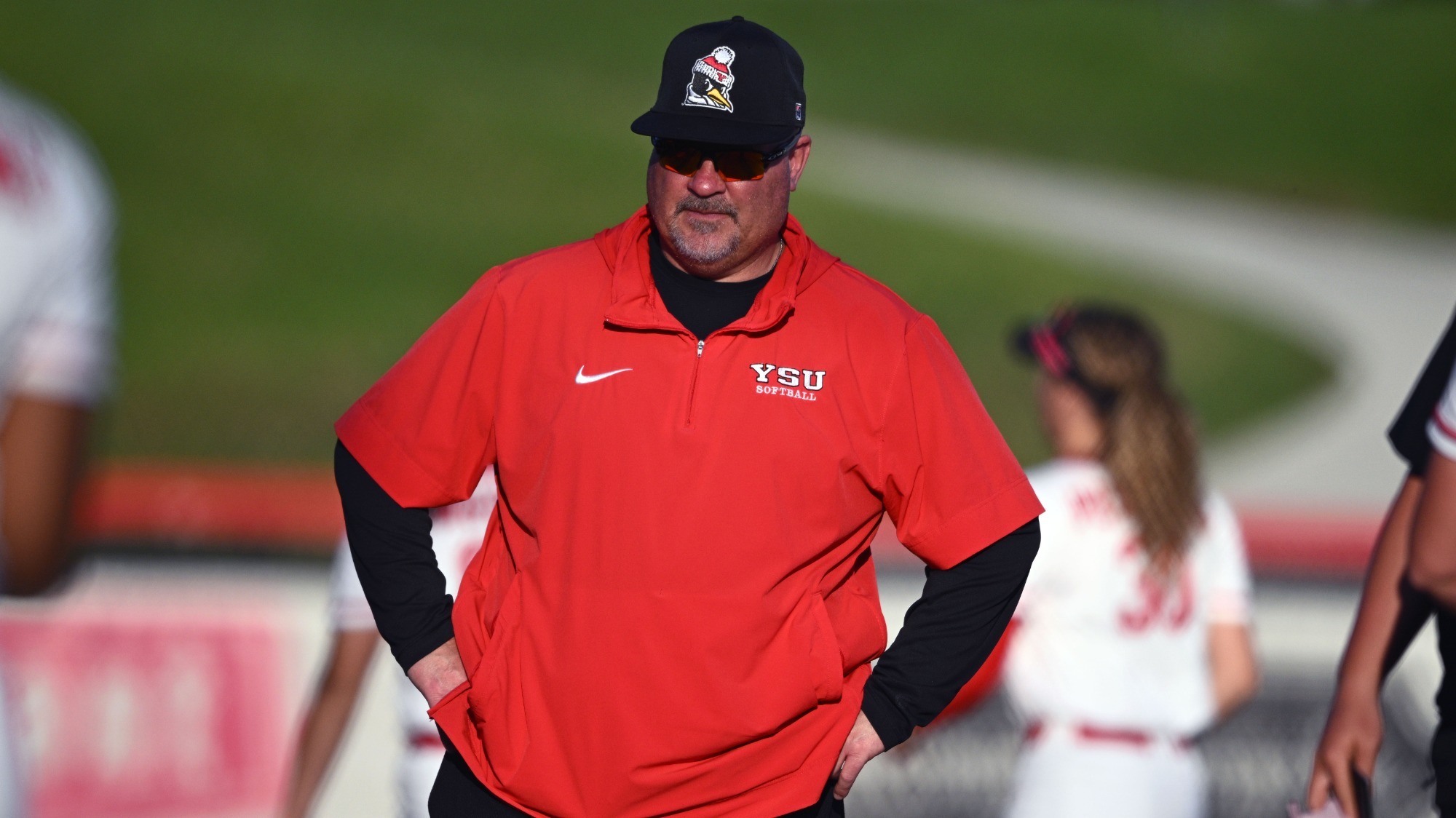 Head Coach Brian Campbell standing in the third base coaching box in a game against Mercyhurst on April 14, 2026