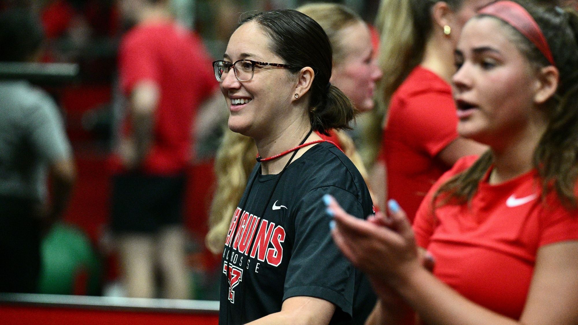 Mary Beth George smiles as she conducts a workout at YSU.