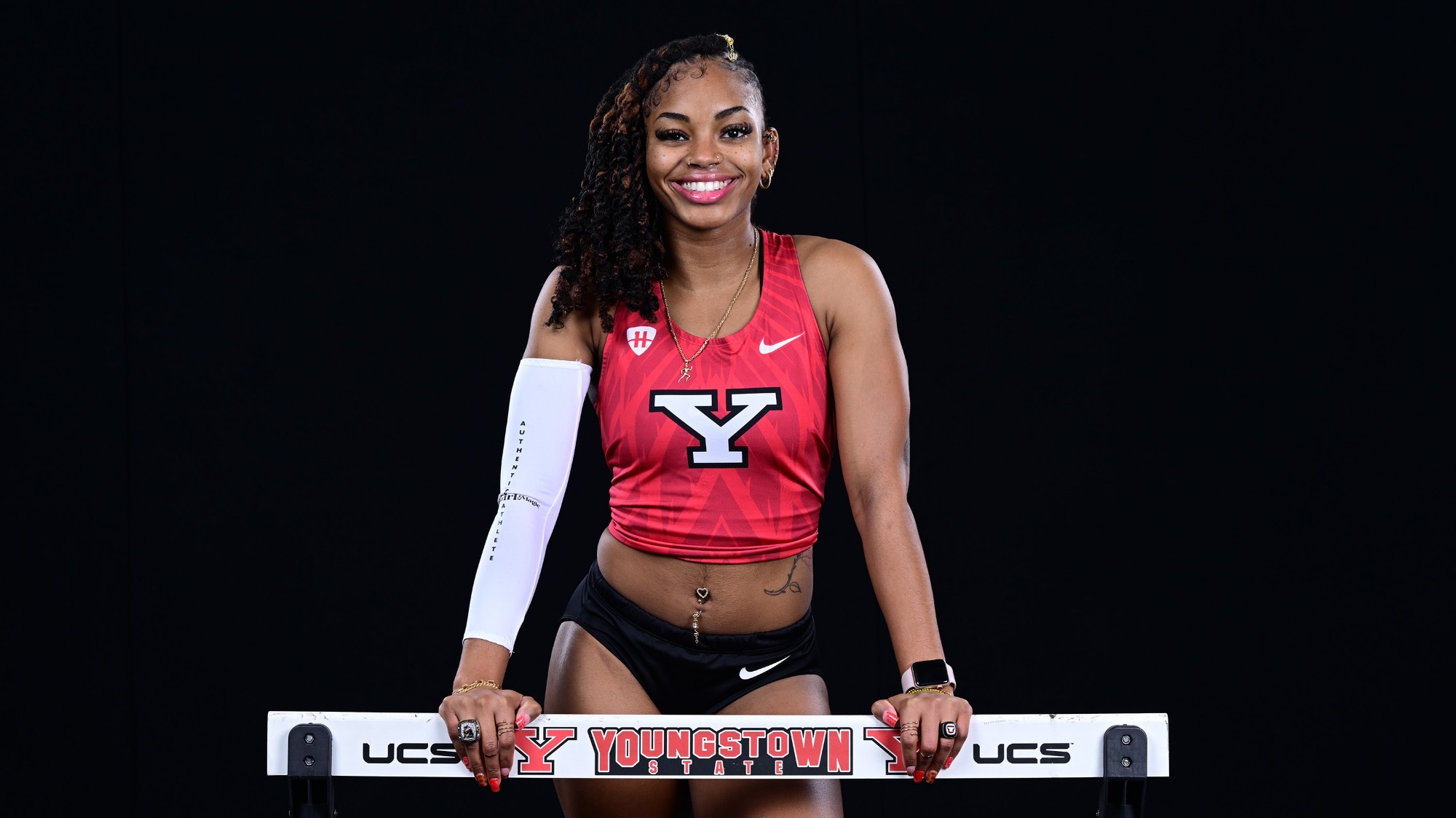Madison Murry poses with a hurdle at 2026 Track and Field Media Day