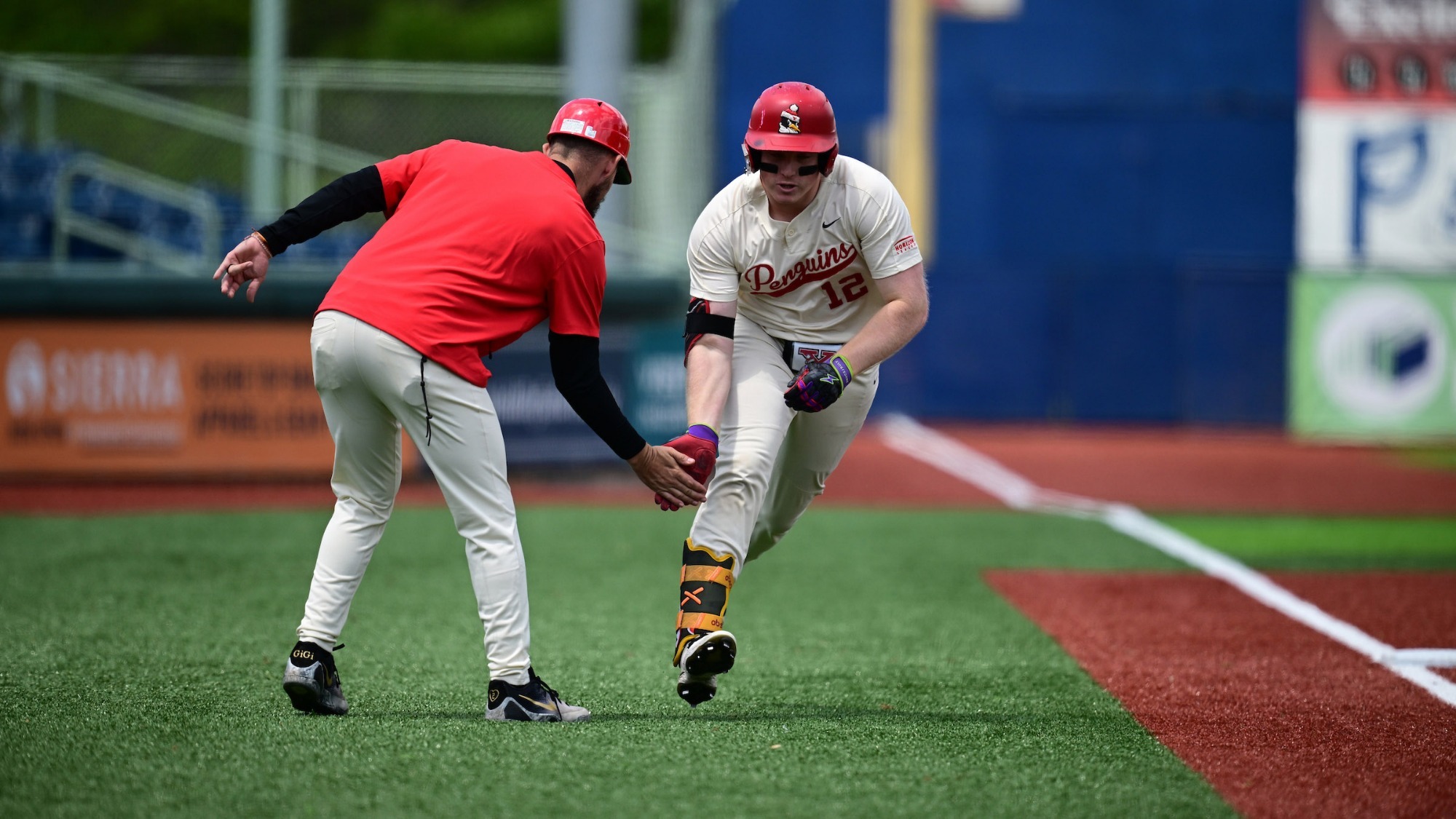 Ryan Schummer celebrates with YSU Head Coach Trevor Charpie after hitting a home run in a baseball game vs. Milwaukee on May 9, 2026 (Photo by Dave Dermer)
