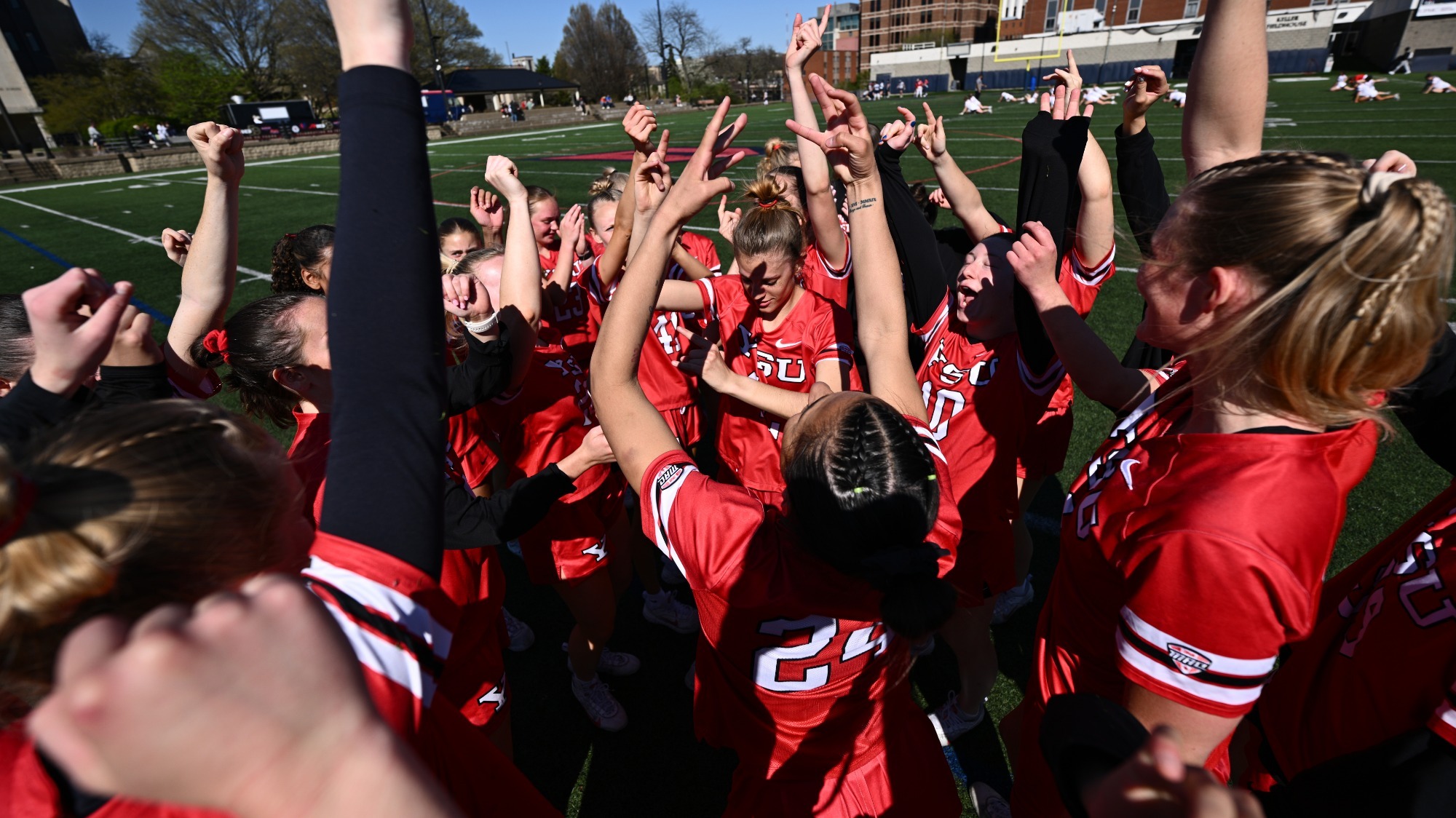Women's Lacrosse celebrates following their win at Duquesne