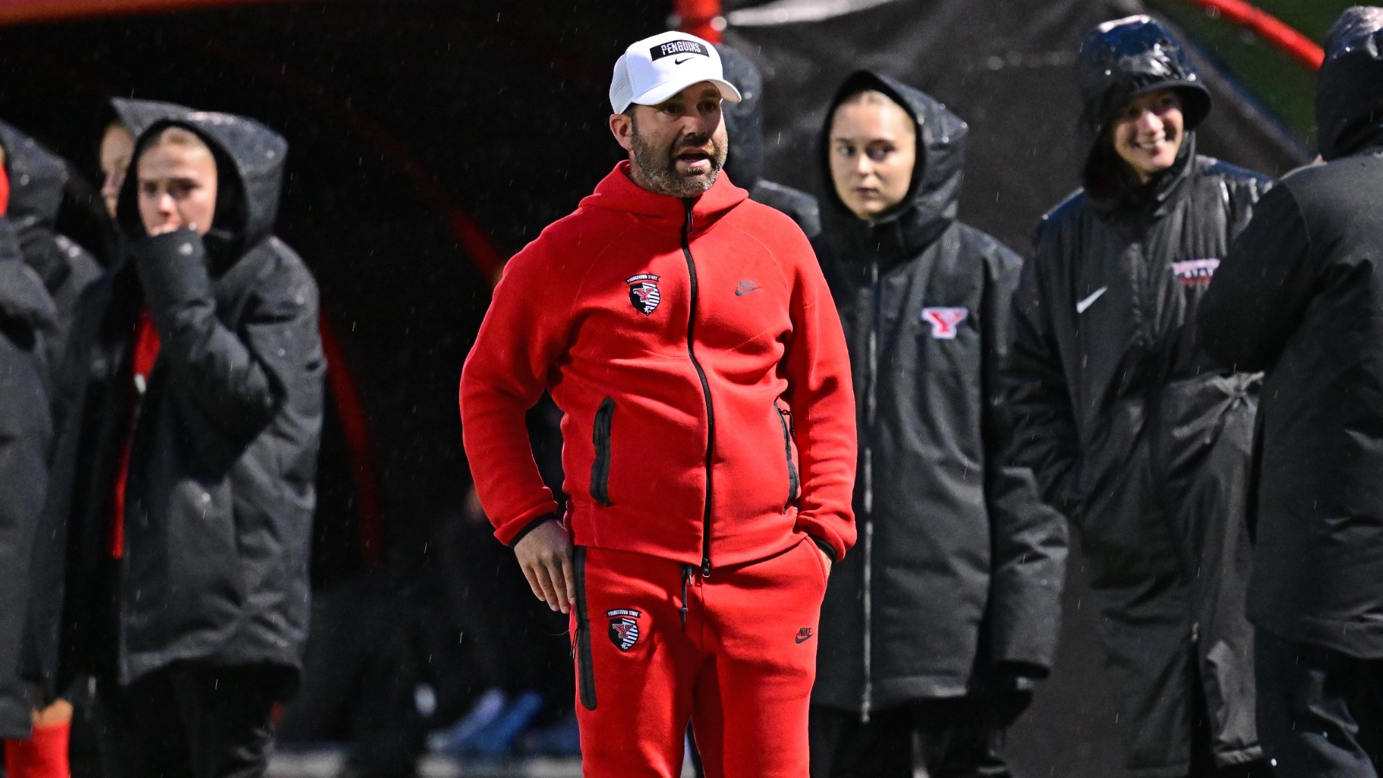 Head Coach Rich Wall paces on the sideline during a night game at Farmers National Bank Field