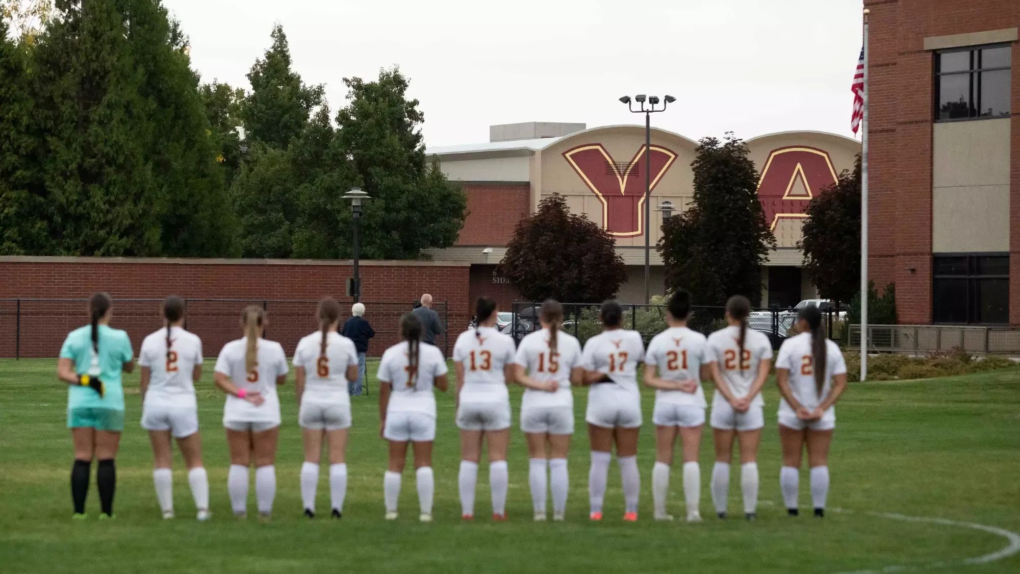 Team salutes the flag