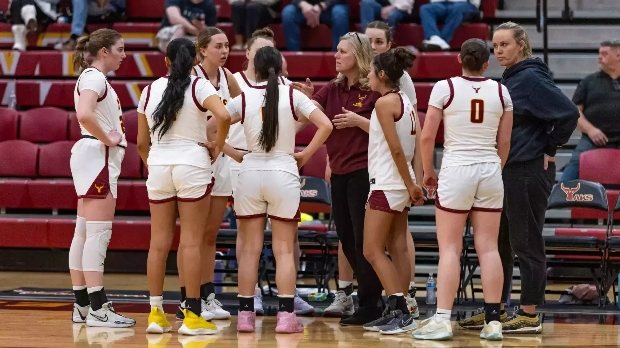 Coach Lanette Hooper leads huddle